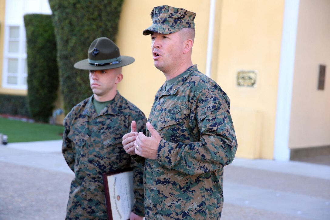 Brig. Gen. James W. Bierman, commanding general, Marine Corps Recruit Depot San Diego and Western Recruiting Region speaks to an audience about Gunnery Sgt. Michael H. Wampler, who was named Drill Instructor of the Year, aboard the depot, Dec. 12.  Wampler, chief drill instructor, Special Training Company, Support Battalion, was also meritoriously promoted.  