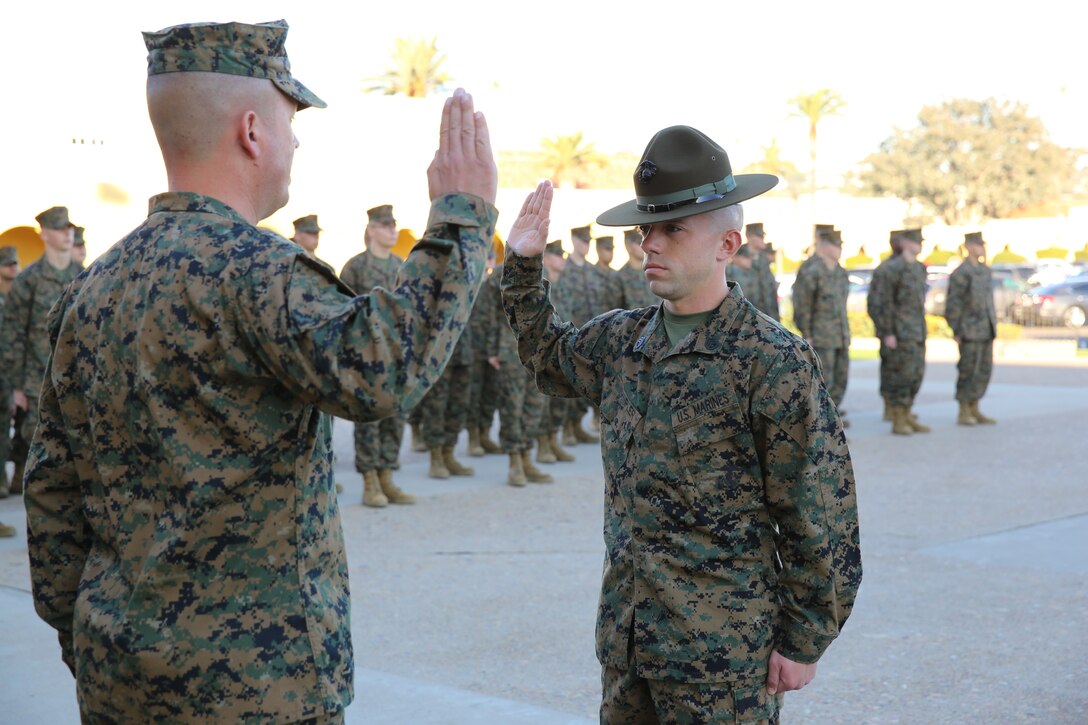 Gunnery Sgt. Michael H. Wampler, Drill Instructor of the Year, reaffirms the Oath of Enlistment while being meritoriously promoted by Brig. Gen. James W. Bierman, commanding general, Marine Corps Recruit Depot San Diego and Western Recruiting Region aboard the depot, Dec. 12.  The Drill Instructor of the Year award was part of the 2013 Commandant of the Marine Corps’ Combined Awards Program, which awards a Drill Instructor of the Year, Recruiter of Year, Prior Service Recruiter of the Year, Marine Combat Instructor of the Year, Marine Security Guard of the Year and Career Retention Specialist of the Year.