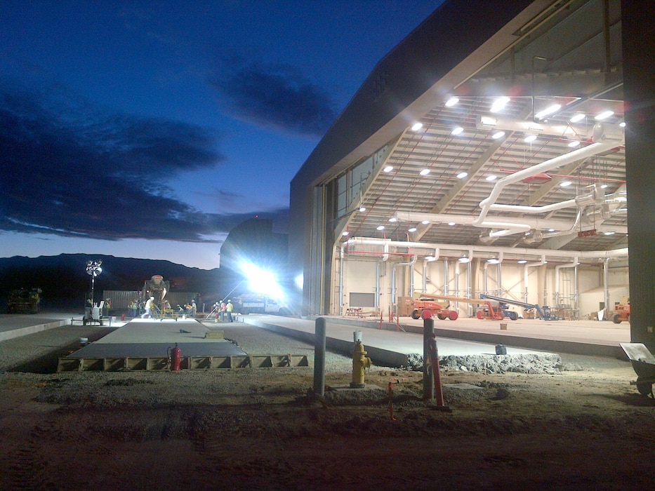 KIRTLAND AIR FORCE BASE, N.M., -- "Placing concrete before sunrise using the lights of the new Fuel Cell Maintenance Hangar." This photo placed second based on employee voting. Photo by Jacob Chavez, July 18, 2013.