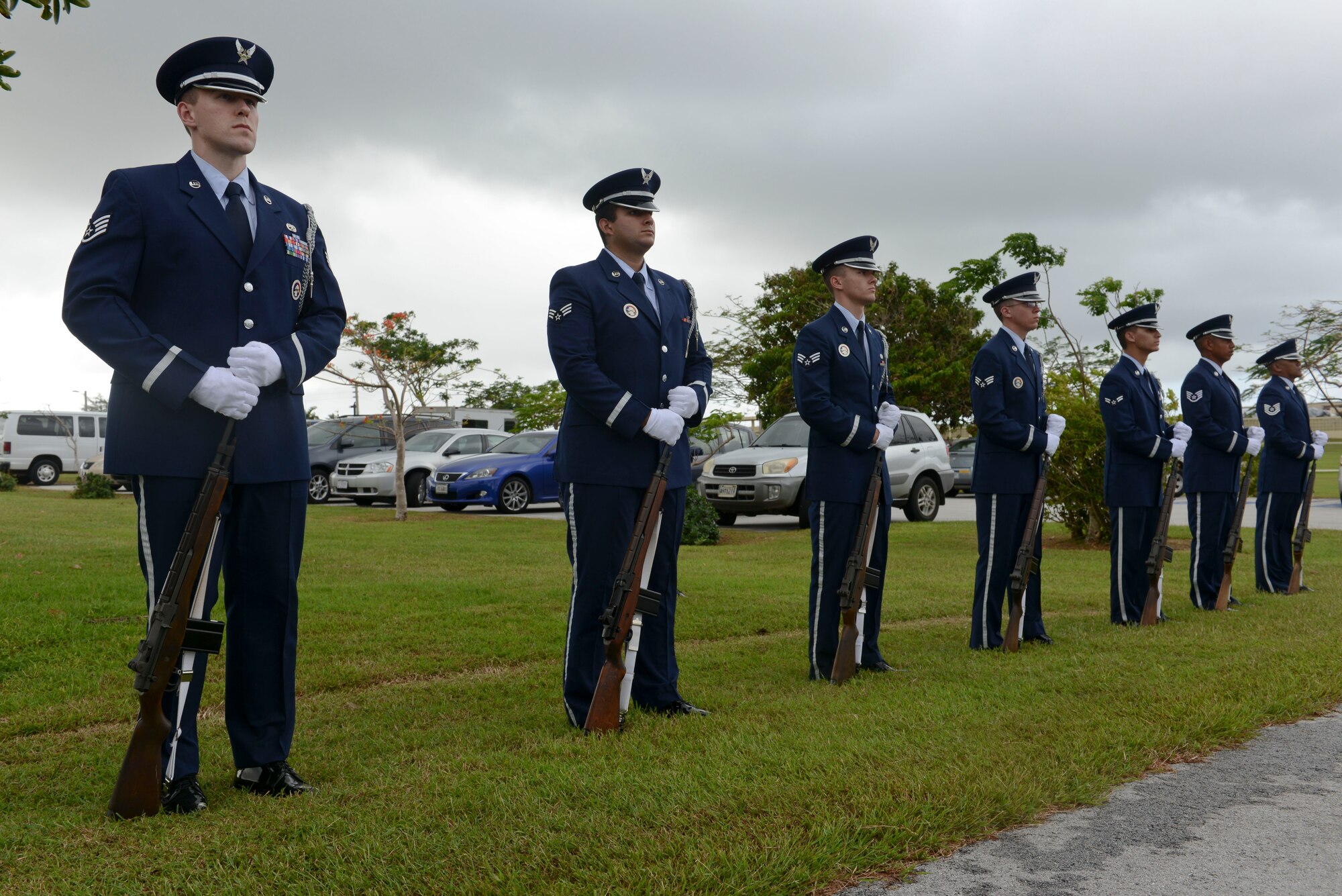 The base honor guard team lowers the flag to half-staff during the Linebacker II ceremony Dec. 13, 2013, on Andersen Air Force Base, Guam. The flag will be at half-staff for 11 days, representing Operation Linebacker II, which led to the end of the Vietnam War in 1972. (U.S. Air Force photo by Airman 1st Class Emily A. Bradley/Released)