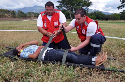 Members of the Honduras Red Cross participate in a disaster response exercise as part of an American Academy of Pediatric Disaster “Train the Trainer” course at Soto Cano Air Base, Honduras, Dec. 13, 2013. The three-day course provided training to members of the Honduran Academy of Pediatrics, the Honduran Red Cross, Honduran first responders, and members of the Permanent Contingency Commission of Honduras (COPECO) in the planning for and care of pediatric populations post-disaster. (U.S. Air Force photo by Capt. Zach Anderson)