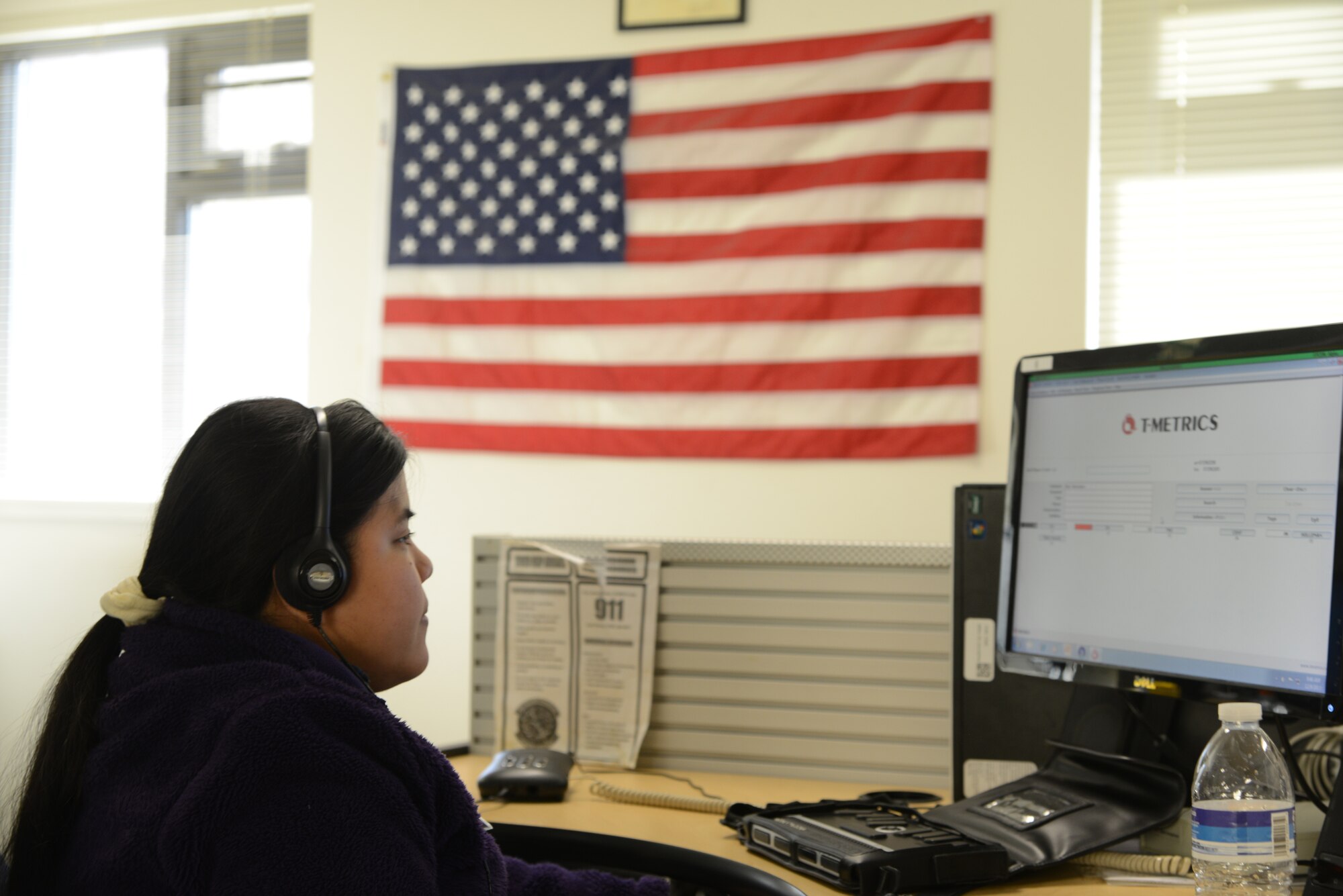 Mary Beltran, United States Air Force Telephone Operator Consolidated Call Center-West operator, answers calls Dec. 9 at Travis Air Force Base, Calif. Beltran is one of 39 operators who works with the base in conjunction with National Industries for the Blind and Solano Diversified Services to provide employment opportunities to those with visual and physical impairments. (U.S. Air Force photo/Nick DeCicco)