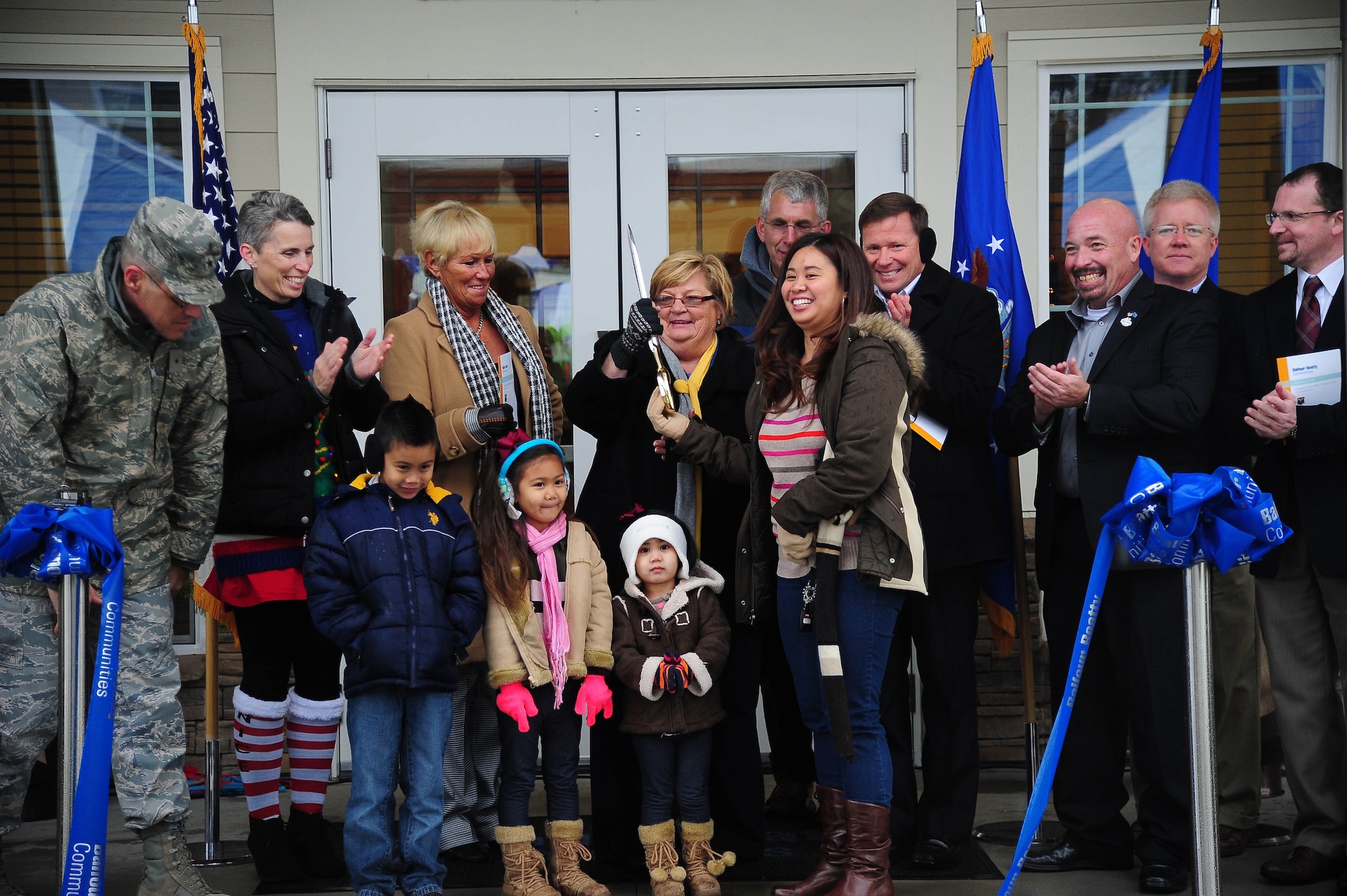 Members from the Whiteman community celebrate the grand opening of the new Balfour Beatty Communities multi-facility Dec. 13, 2013, at Whiteman Air Force Base, Mo. The facility features a Recreation Center, Community Center and Maintenance Facility, and is open to Whiteman family housing residents. (U.S. Air Force photo by Staff Sgt. Brigitte N. Brantley/Released)