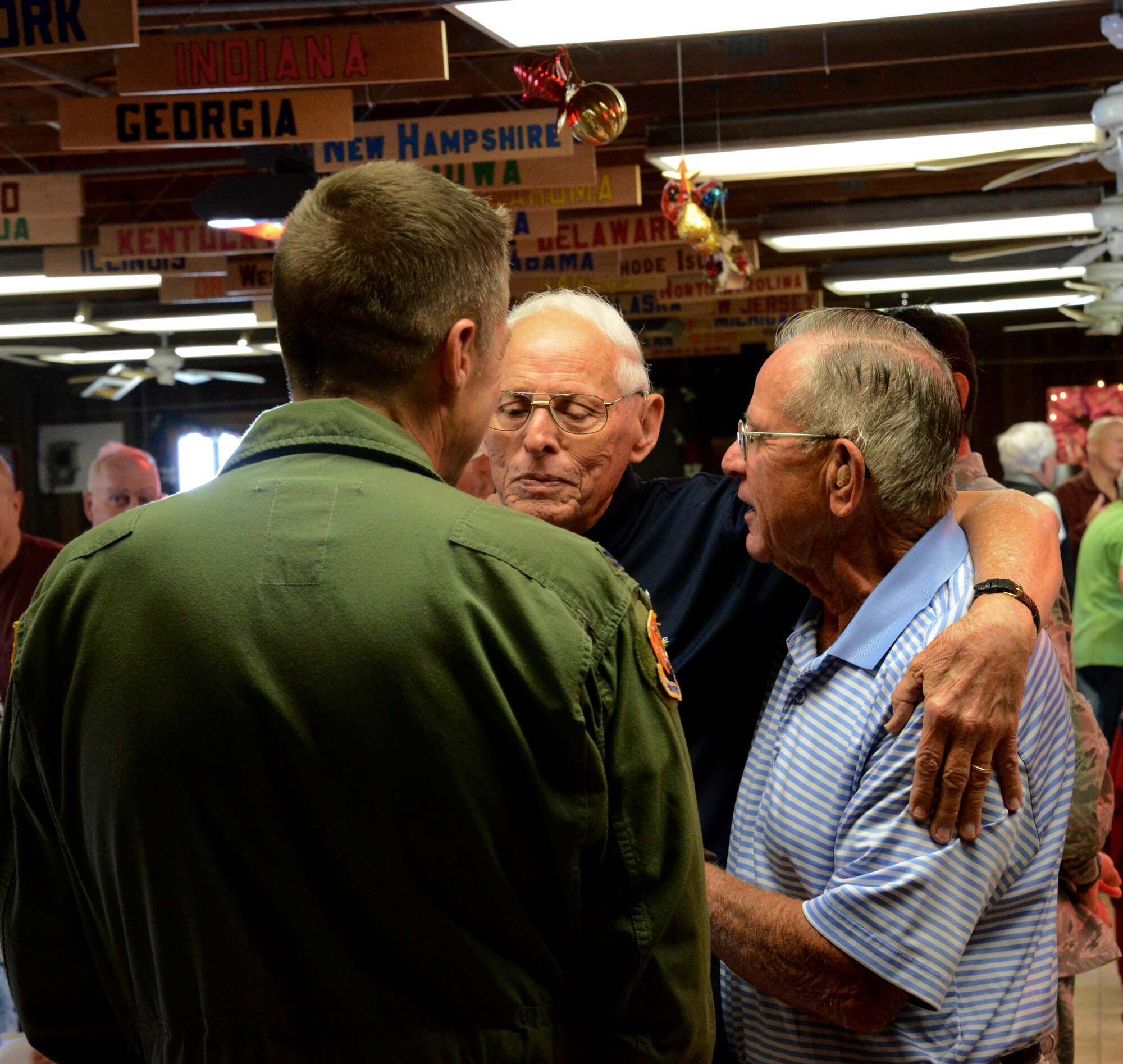 Col Scott DeThomas, 6th Air Mobility Wing commander, interacts with residents of the family campground during the Welcome Back Party Dec. 13, 2013 at MacDill Air Force Base, Fla. This event introduces leadership and provides a social gathering for the new campers to get to know each other.(U.S. Air Force photo by Senior Airman Jenay Randolph/Released)
