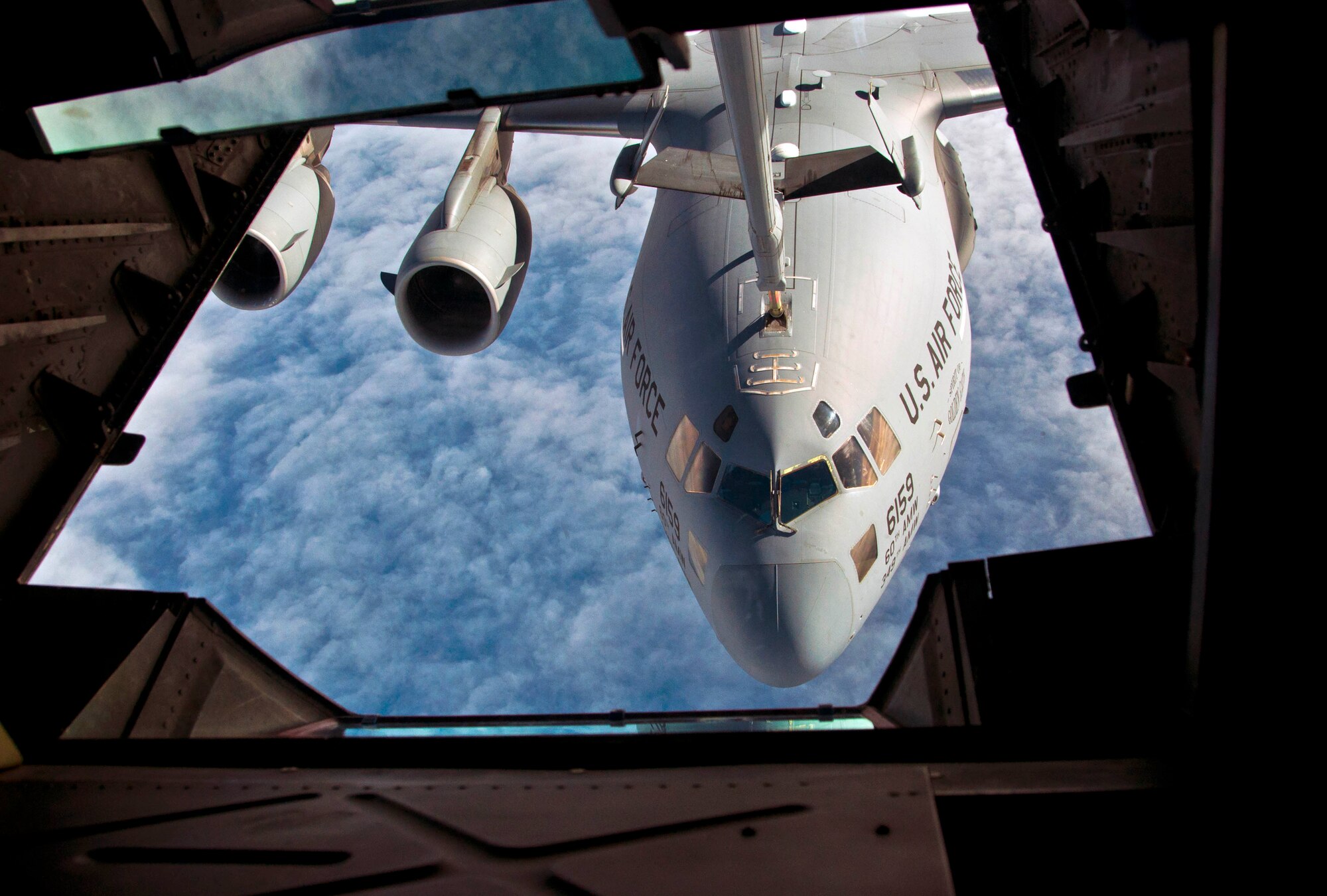 The boom operator makes contact with a C-17 Globemaster III for in-flight refueling Dec. 6 during a 60th Operations Group tour for honorary commanders. (U.S. Air Force photo/Senior Airman Madelyn Brown)
