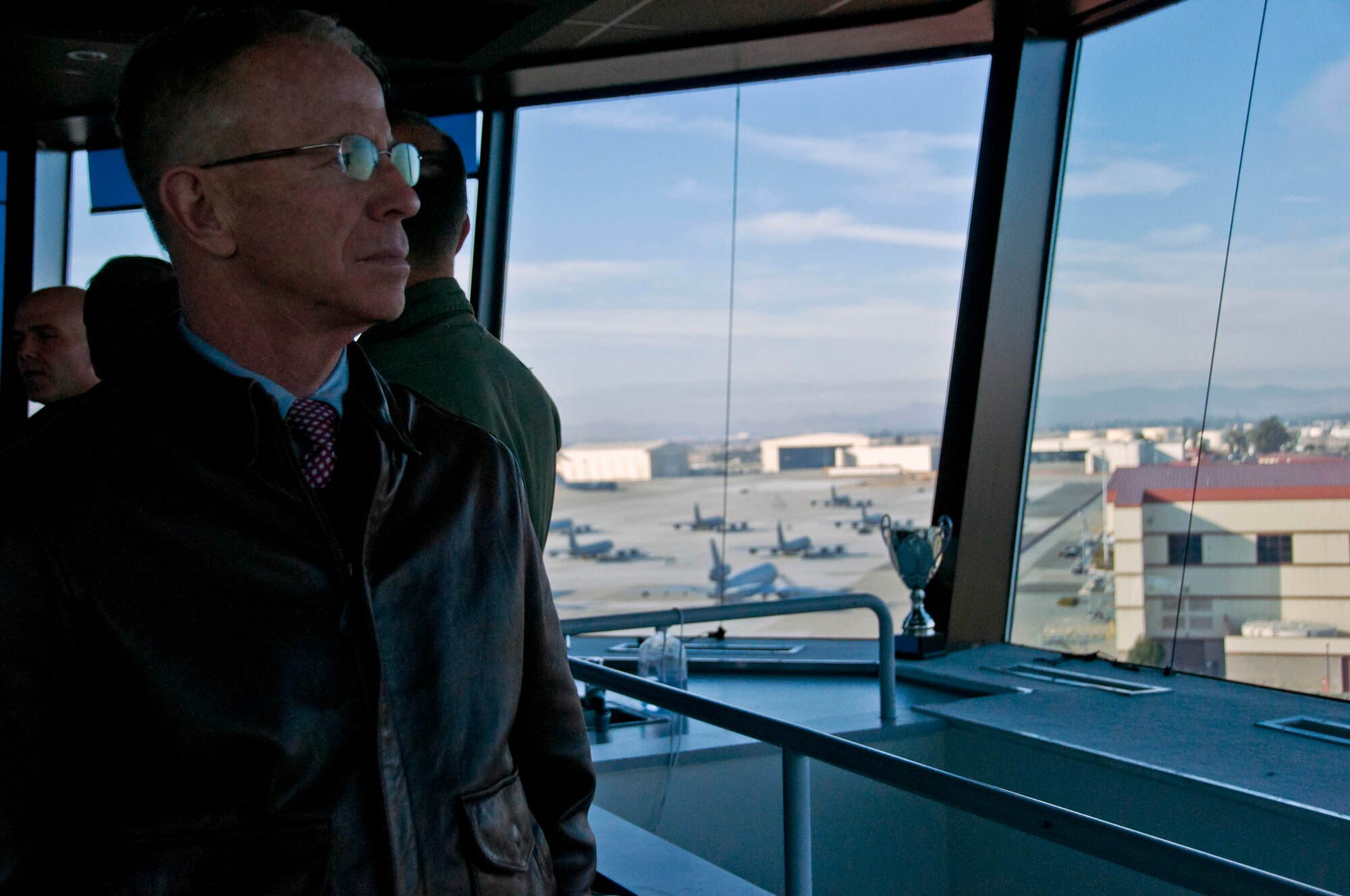 Greg DuPratt, 60th Logistics Readiness Squadron, observes the Travis flightline from the air traffic control tower Dec. 6 during the honorary commander tour of the 60th Operations Group. (U.S. Air Force photo/Senior Airman Madelyn Brown).
