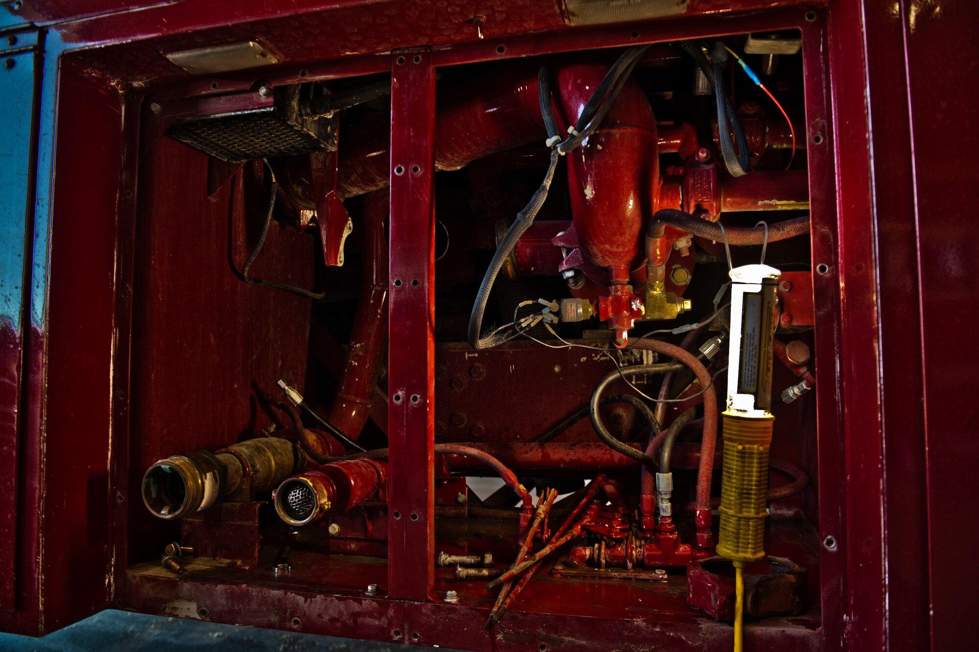 Shown is the inside of a P-19 fire truck during a relief valve replacement performed by the 49th Logistics Readiness Squadron and Col. Kevin Bennett, 49th Mission Support Group commander at Holloman Air Force Base, N.M., Dec. 11. Bennett spent the day working hands-on with fire truck mechanics of the 49th LRS to get an insight of their daily life and connect with the airmen. (U.S. Air Force photo illustration by Airman 1st Class Aaron Montoya/Released)