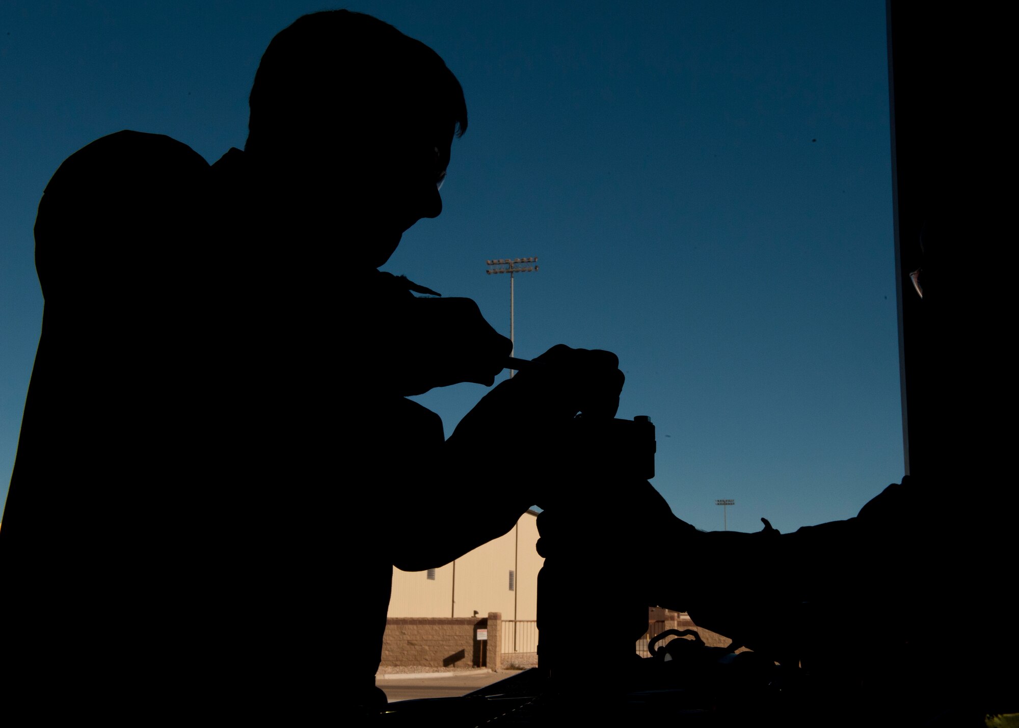 Colonel Kevin Benett, 49th Mission Support Group commander prepares a new relief valve to be installed in a P-19 fire truck at Holloman Air Force Base, N.M., Dec. 11. Bennett spent the day working hands-on with fire truck mechanics of the 49th Logistics Readiness Squadron to get an insight of their daily life and connect with the airmen. (U.S. Air Force photo by Airman 1st Class Aaron Montoya/Released)