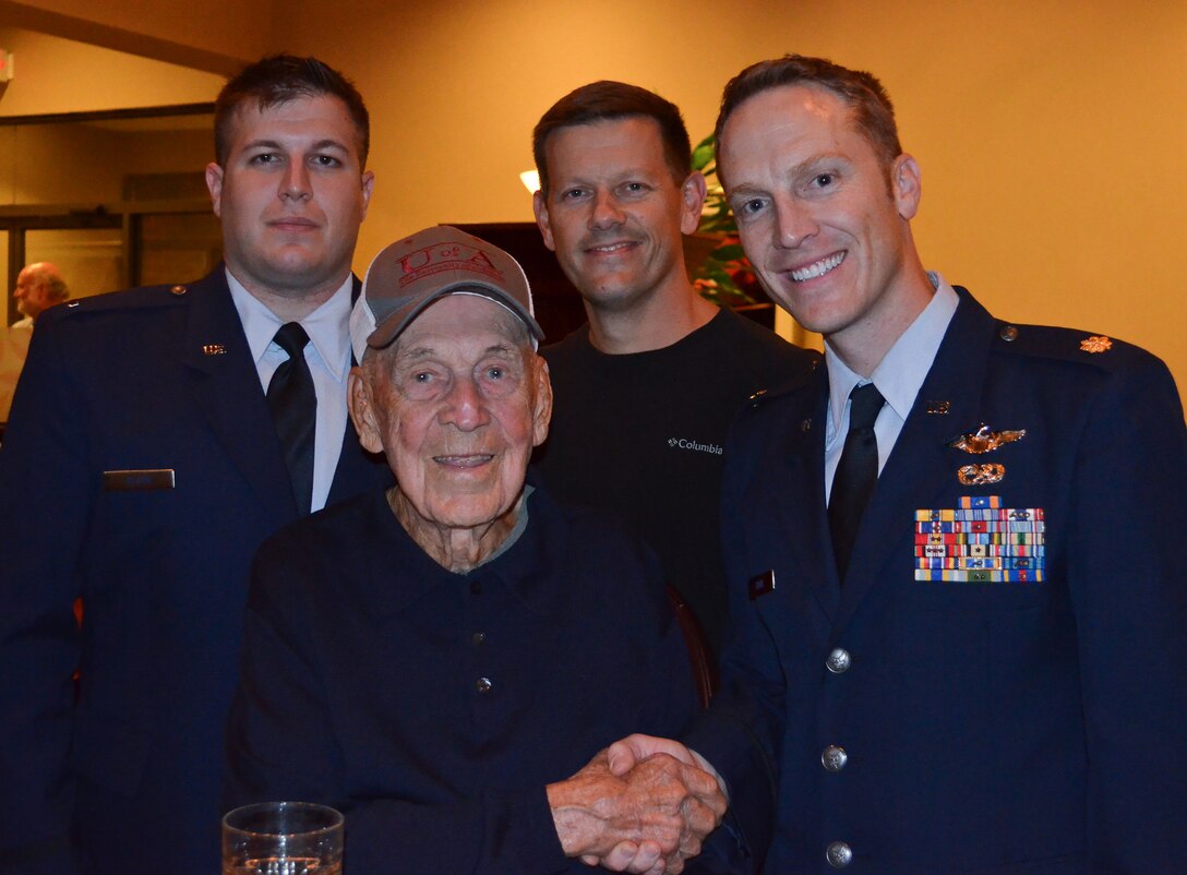 (From left) First Lt. Arman Olgun, 34th Bomb Squadron B-1 weapons systems operator, retired Lt. Col. Dick Cole, Col. Jimmy Doolittle’s co-pilot on crew 1, Lt. Col. John Martin, former 34th BS commander and current Air War College student and Maj. Donovan Davis, 28th Operations Support Squadron weapons and tactics assistant director of operations, pose for a quick photo during the Doolittle Raider final toast at Wright-Patterson Air Force Base, Ohio, Nov. 9, 2013. (U.S. Air Force courtesy photo)