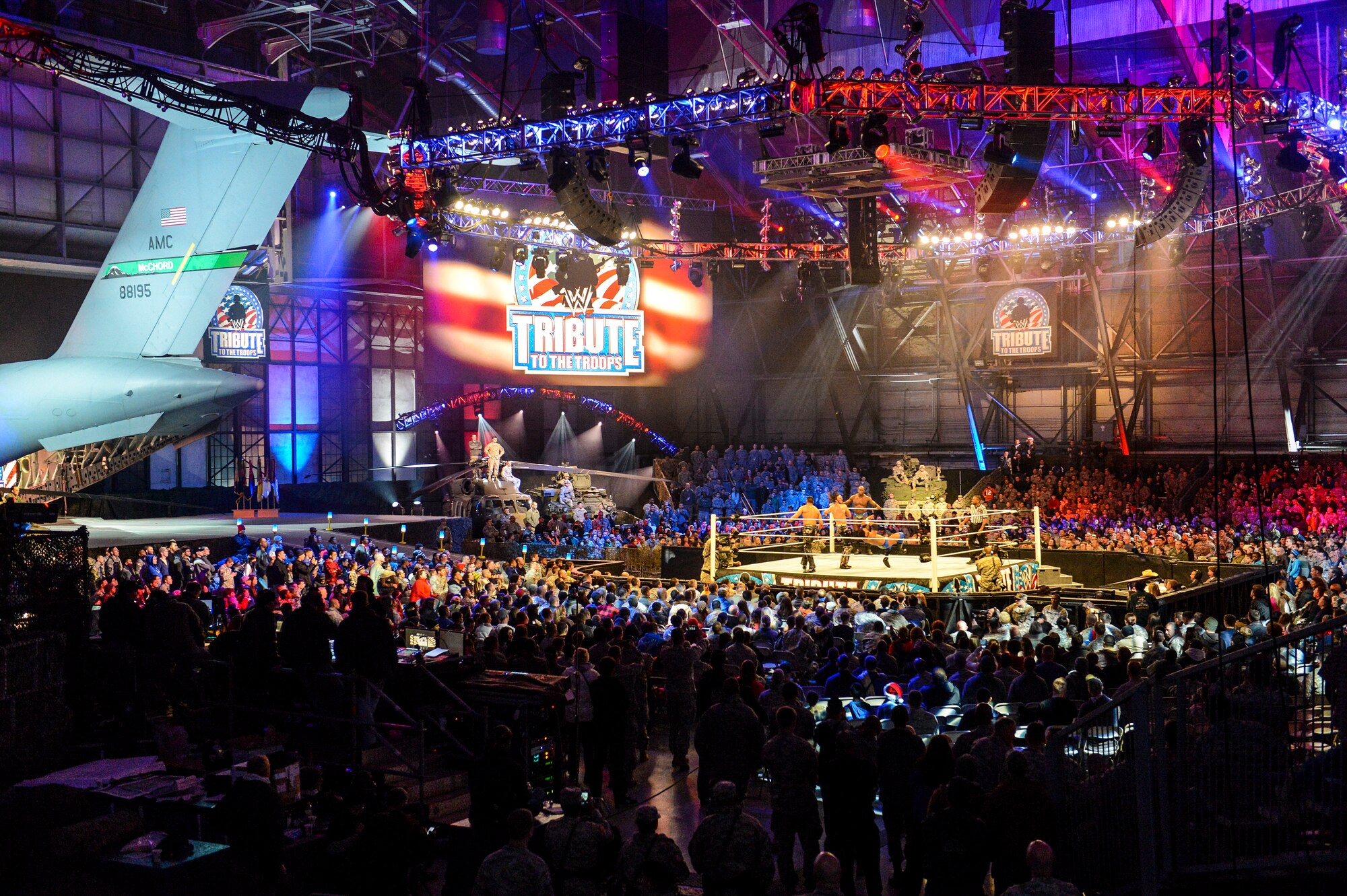 Approximately 4,000 service members and their families attend a World Wrestling Entertainment match, Dec. 11, 2013, at Joint Base Lewis-McChord, Wash. The nationally televised event took place in a McChord Field hangar, which WWE production crews transformed into a wrestling arena. (U.S. Air Force photo/Tech. Sgt. Sean Tobin)