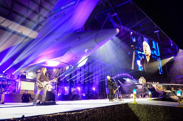 Rock band Daughtry performs under the tail of a C-17 Globemaster III in McChord Field's hangar four, Dec. 11, 2013, at Joint Base Lewis McChord, Wash. The band's performance was part of the World Wrestling Entertainment's Tribute to the Troops event at JBLM. (U.S. Air Force photo/Tech. Sgt. Sean Tobin)