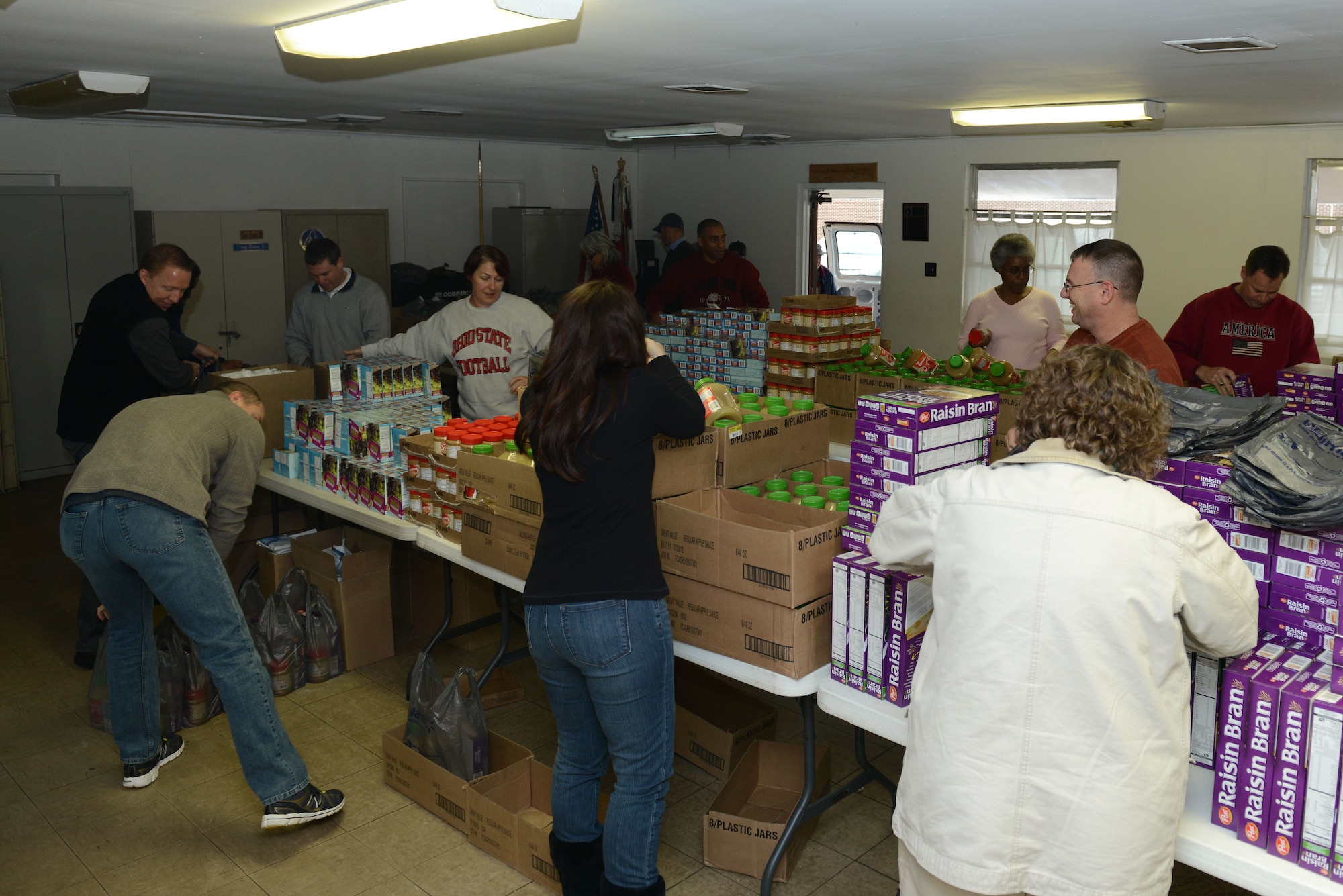 Service members from the Air Land Sea Application Center at Langley Air Force Base volunteered to assist the Peninsula Agency on Aging program in Newport News, Va., Dec. 10, 2013.  The opportunity allowed ALSA, to demonstrate the multi-service organizations commitment to the community. (U.S. Air Force photo by Airman 1st Class Kimberly Nagle/Released)