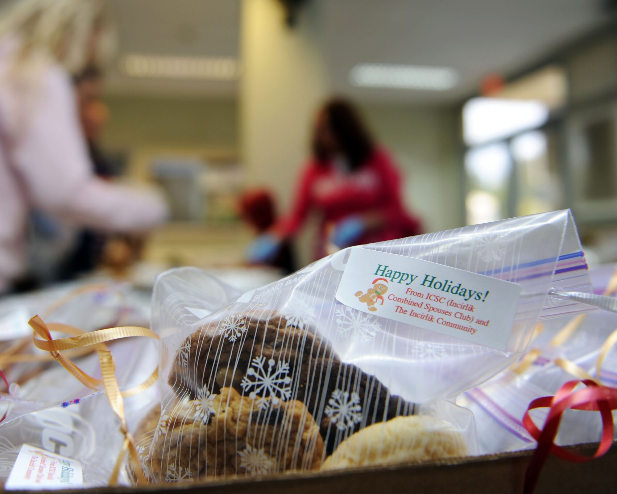 Bagged cookies are boxed for delivery at the end of a bagging line during The Great Cookie Caper on Dec. 11, 2013, at Incirlik Air Base, Turkey. More than 7,300 cookies were baked, stored, bagged and delivered during this year’s cookie caper. (U.S. Air Force photo by Senior Airman Chase Hedrick/Released)