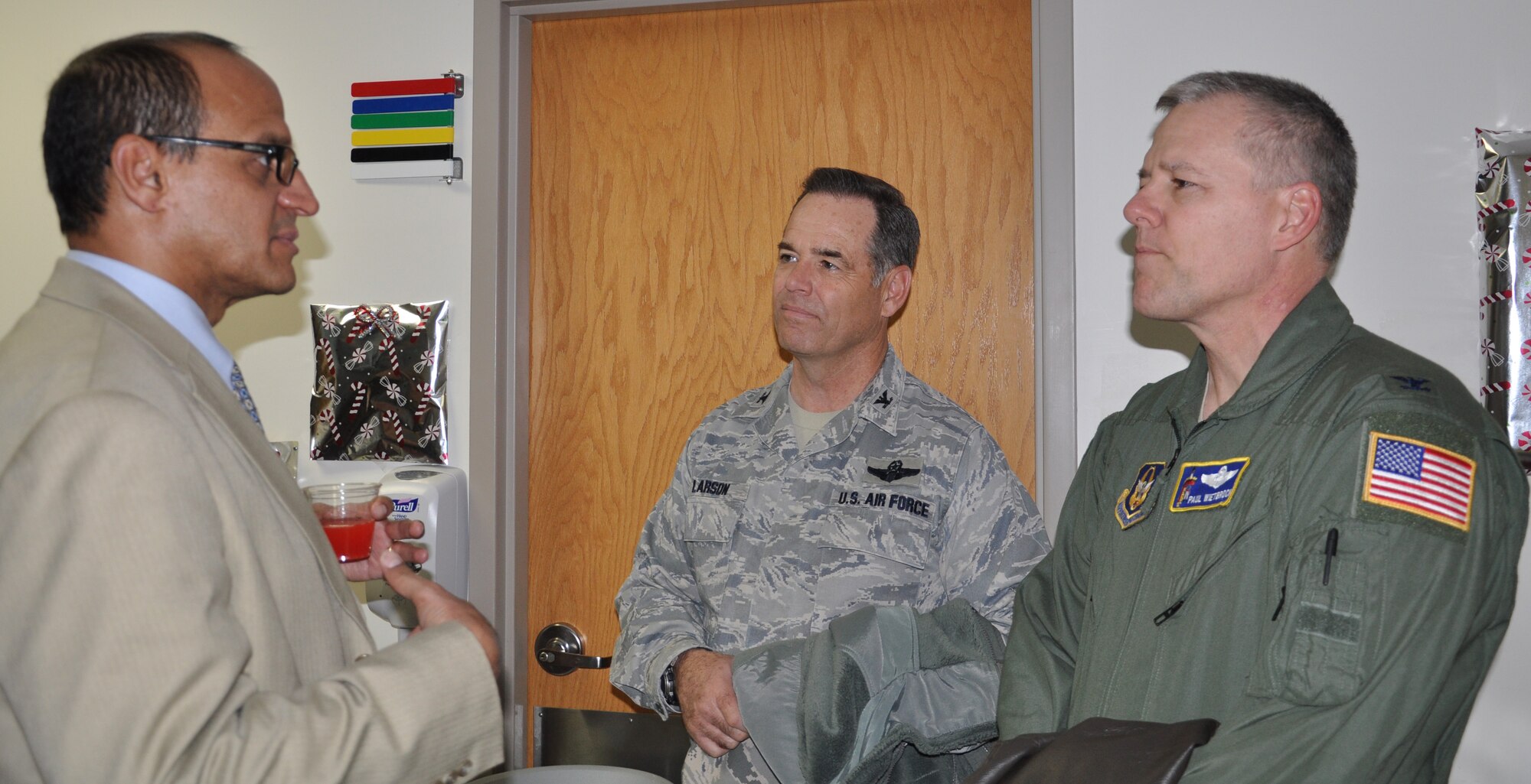 Col. Mark S. Larson, 931st Air Refueling Group Commander and Col. Paul R. Wietbrock, 931st ARG Deputy Commander, speak with Francisco Vazquez, director, Robert J. Dole Veterans Administration Medical Center during the hospital's 3rd Annual Open House, Dec. 11. Members of the 931st ARG and the Wichita Community were invited to attend the event established in honor of Reservists in the area.  Larson and Wietbrock received a tour of the VA and met with staff and patients at the facility, which supports more than 30,000 veterans. (Air Force photo by Master Sgt. Brannen Parrish)