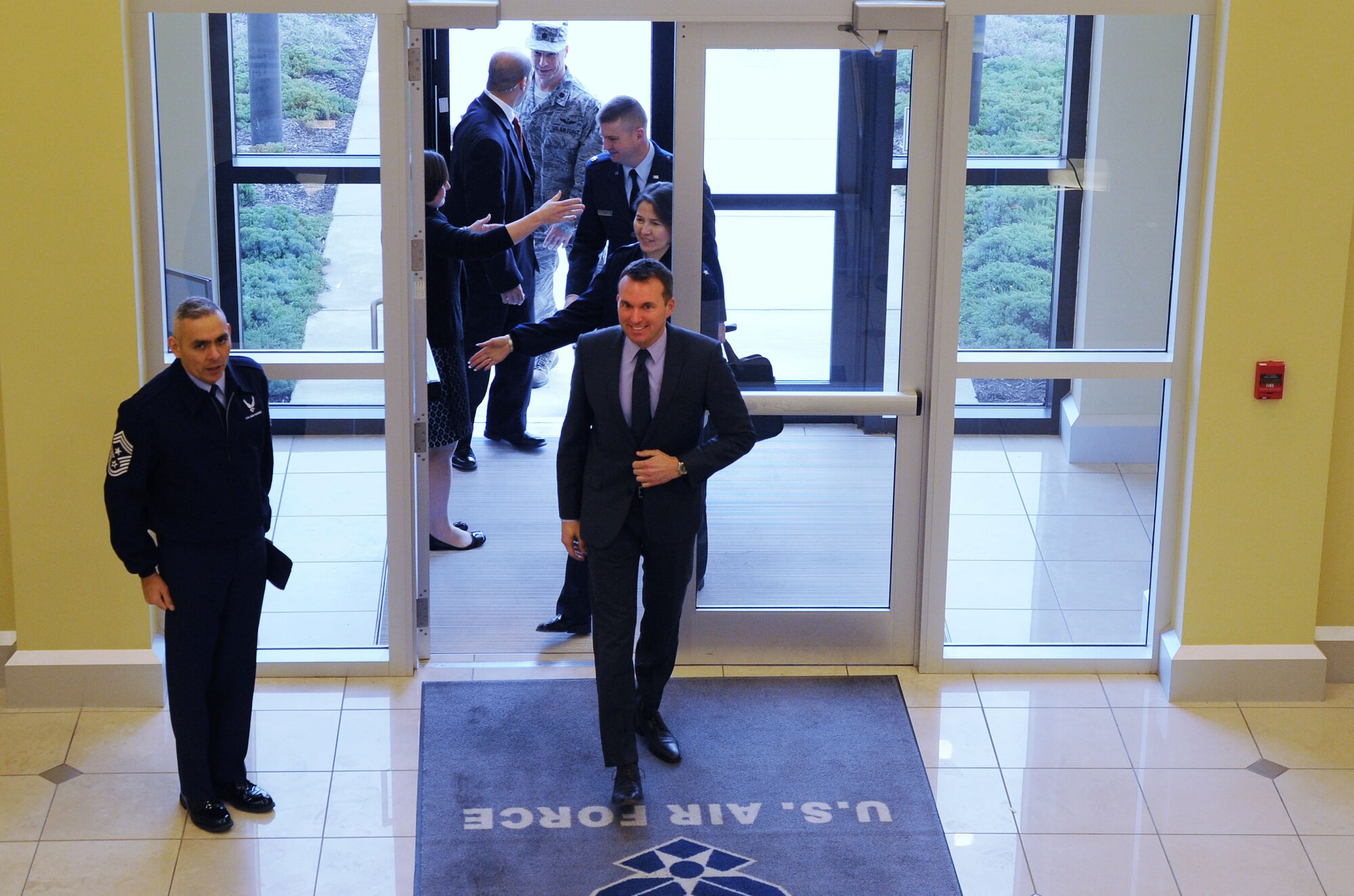 Air Force District of Washington Command Chief Master Sgt. Jose LugoSantiago calls the General Jacob E. Smart Center to attention as Acting Secretary of the Air Force Eric Fanning arrives to the 2013 Capital Airmen Development Seminar on Joint Base Andrews, Md., Dec. 5, 2013. Fanning is responsible for the affairs of the Department of the Air Force, including the organizing, training, equipping and providing for the welfare of its more than 333,000 active duty Airmen, 178,000 members of the Air National Guard and the Air Force Reserve, 182,000 civilians and their families. (U.S. Air Force photo/Tech. Sgt. Tammie Moore)