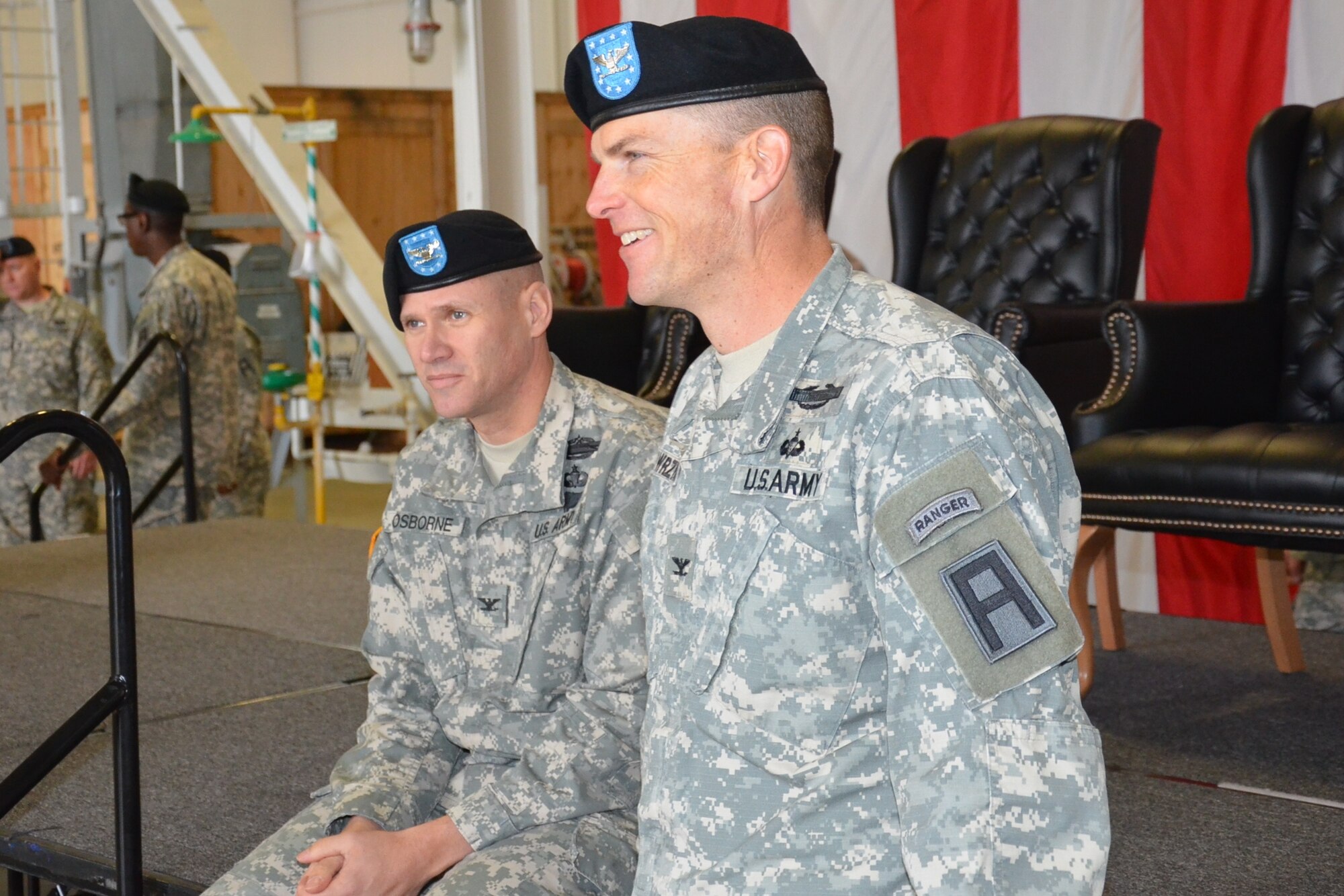 Col. Craig A. Osborne, outgoing commander of the 174th Infantry Brigade and Col. Michael E. Wawrzyniak, new commander, share a moment during the change of command ceremony rehearsal Dec. 5, 2013, at Joint Base McGuire-Dix-Lakehurst, N.J. (U.S. Army photo by Sgt. 1st Class Raymond Alston/Released) 