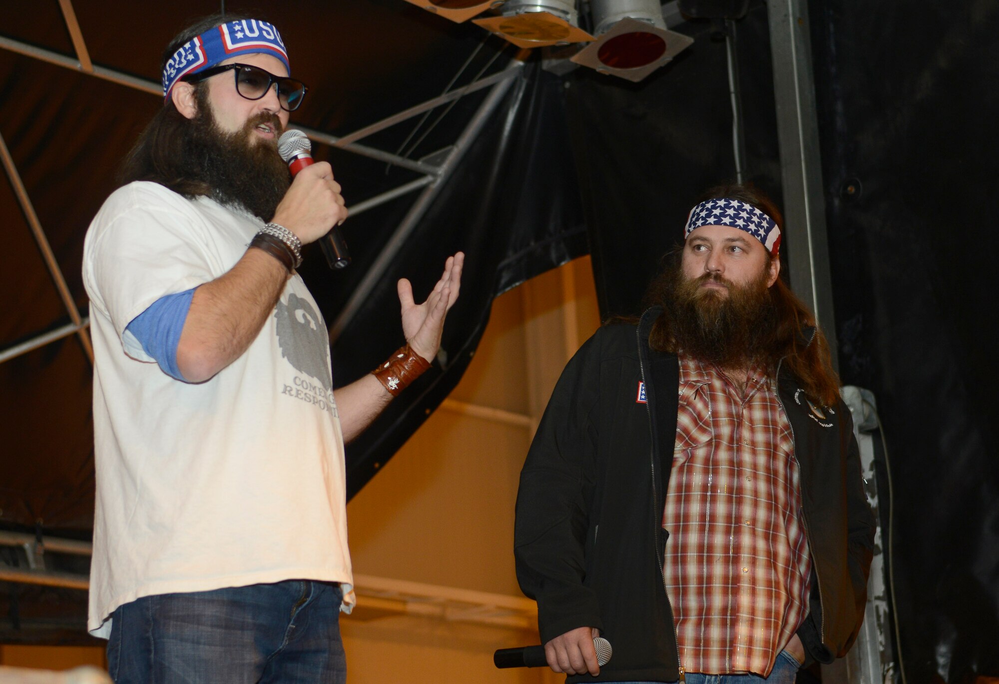 Jep and Willie Robertson, “Duck Dynasty” reality TV personalities, entertain audience members during the United Services Organization’s Annual Chairman’s Holiday Tour, Dec. 11, 2013, at Aviano Air Base, Italy.  The USO was built on the values of support and lifting the spirits of America’s troops by sending entertainment to different military bases around the world. (U.S. Air Force photo/ Airman 1st Class Deana Heitzman)