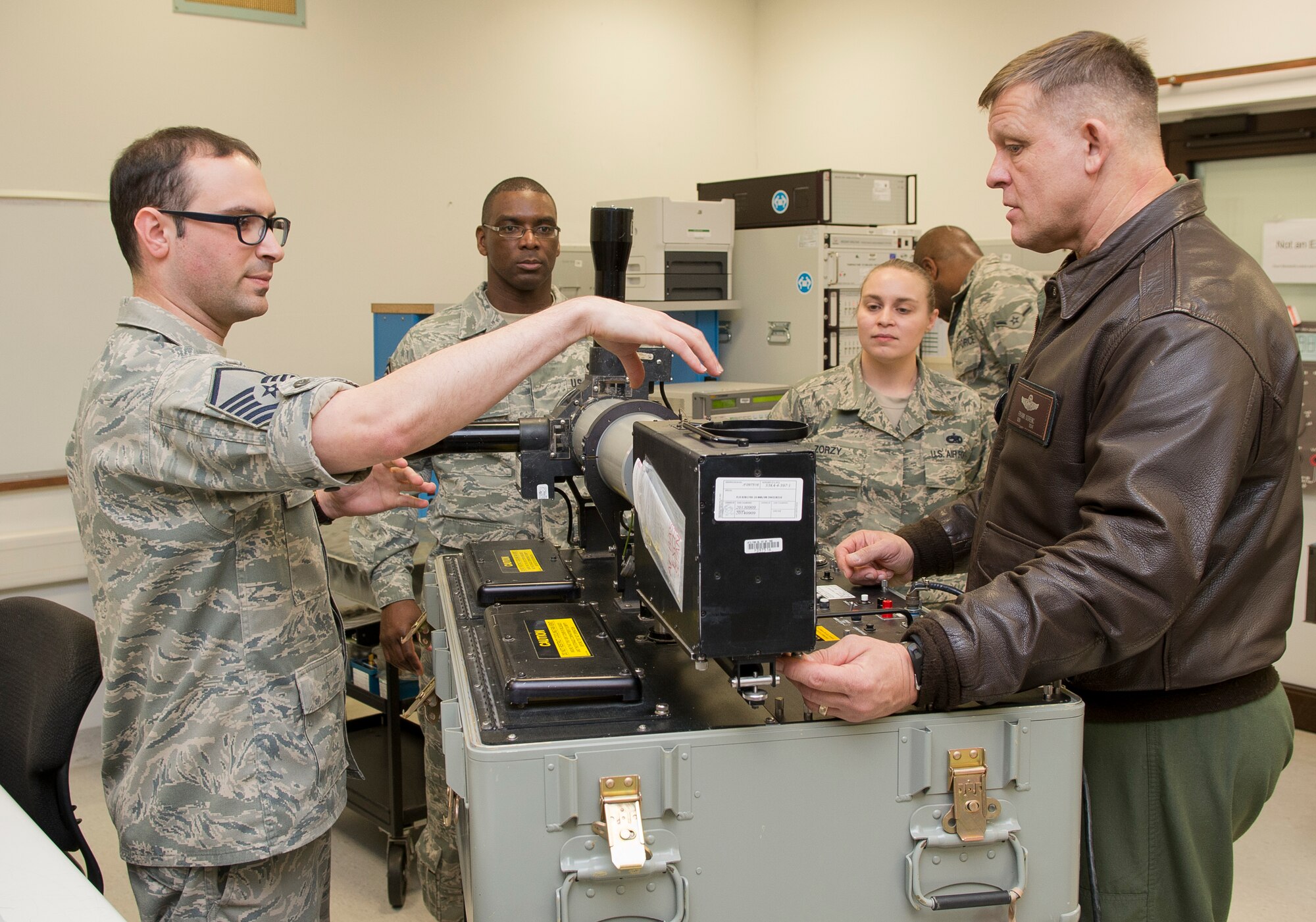 Master Sgt. Eric Perniciaro, 86th Maintenance Squadron precision measurement equipment laboratory K1/K8 element supervisor, explains how a measuring device works to Gen. Frank Gorenc, U.S. Air Forces in Europe and Air Forces Africa commander, and Chief Master Sgt. James Davis, USAFE-AFAFRICA command chief, during an immersion tour Dec. 3, 2013, Ramstein Air Base, Germany. Immersion tours are held as a way for senior leaders to gain a greater understanding and perspective on how Airmen operate day-to-day. (U.S. Air Force photo/Senior Airman Jose L. Leon)