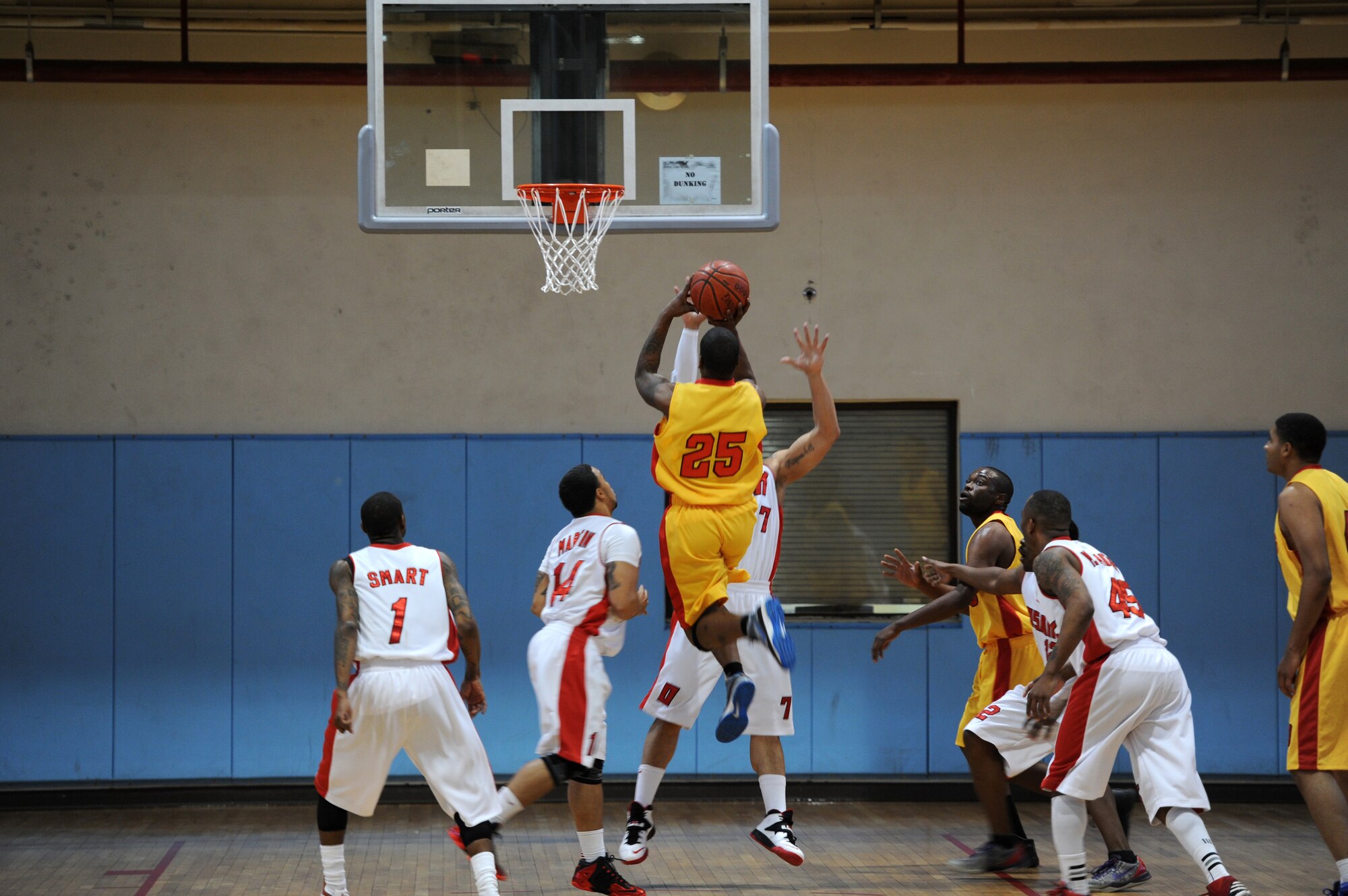 A member of the Suwon basketball team shoots for two points during the Pacific Holiday Basketball Tournament at Osan Air Base, Republic of Korea, Dec. 12, 2013. There are a total of 13 teams competing in the tournament. (U.S. Air Force photo/Staff Sgt. Emerson Nuñez)