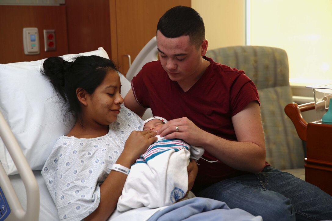 Pfc. Nicholas M. Cabral and wife, Lance Cpl. Lucia Y. Cabral, admire their newborn baby during a post partum stay at Camp Pendleton’s newest hospital. The Naval Hospital Camp Pendleton facility, built in 1969, was officially decommissioned, requiring patients to be relocated to Pendleton’s recently built, 500,000-square foot, replacement hospital Dec. 14. The four-floor building cost $456 million and took more than three years to construct. Lucia is a maintenance management specialist and Nicholas is a warehouse clerk with1st Marine Logistics Group.