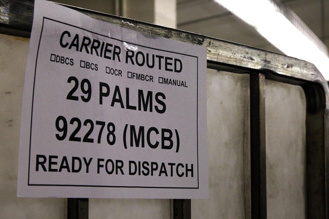 In today’s technological world, a phone call home or an e-mail to a loved one can sometimes fill the void of being away during the holidays, but not quite as much as seeing your name on a package or letter. Working around the clock to fill that void, are six Marines at the Combat Center Post Office who work diligently to sort all Christmas and New Year’s mail so that they arrive on time and intact.