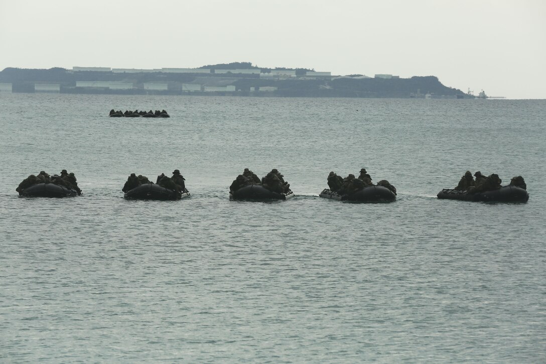 Marines with Company F., Battalion Landing Team 2nd Battalion, 5th Marines, 31st Marine Expeditionary Unit, prepare to land at Kin Blue beach in combat rubber raiding craft during a boat raid training event, Dec. 11. The exercise was part of the 31st MEU’s pre-deployment training package designed to prepare the Marines for the upcoming theater security deployment. The 31st MEU is the Marine Corps’ force in readiness in the Asia-Pacific region and is the only continuously forward-deployed MEU.