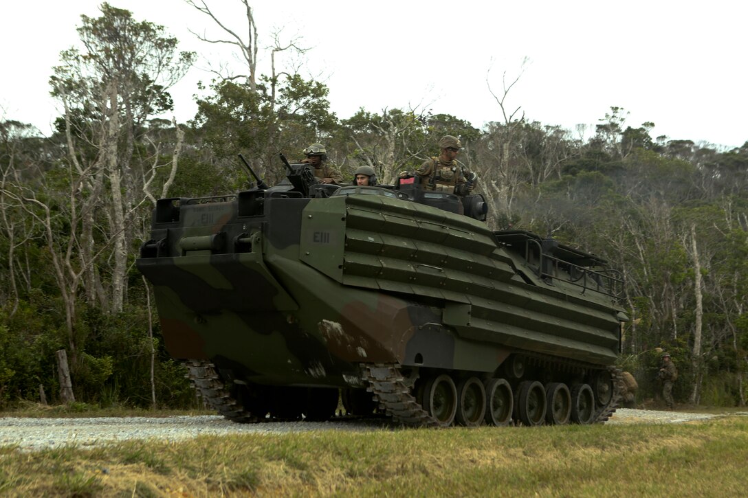 An Amphibious Assault Vehicle transporting Marines of Company E., Battalion Landing Team 2nd Battalion, 5th Marines, 31st Marine Expeditionary Unit, arrives at a notional enemy camp during a mechanized raid on a notional enemy training camp, Dec. 12. The exercise was part of the 31st MEU’s pre-deployment training package, designed to prepare the Marines of the MEU for the next regularly schedule theater security deployment. The 31st MEU is the Marine Corps’ force of readiness in the Asia-Pacific region and is the only continuously forward-deployed MEU.