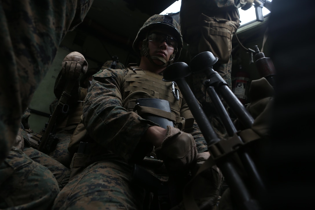 Lance Cpl. Ryan Downey, a rifleman with Company E., Battalion Landing Team 2nd Battalion, 5th Marines, 31st Marine Expeditionary Unit, rides in an Amphibious Assault Vehicle during a mechanized raid on a notional enemy base, Dec. 12. The exercise was part of the 31st MEU’s pre-deployment training package, designed to prepare the Marines of the MEU for the next regularly scheduled theater security deployment. The 31st MEU is the Marine Corps’ force of readiness in the Asia-Pacific region and is the only continuously forward-deployed MEU.