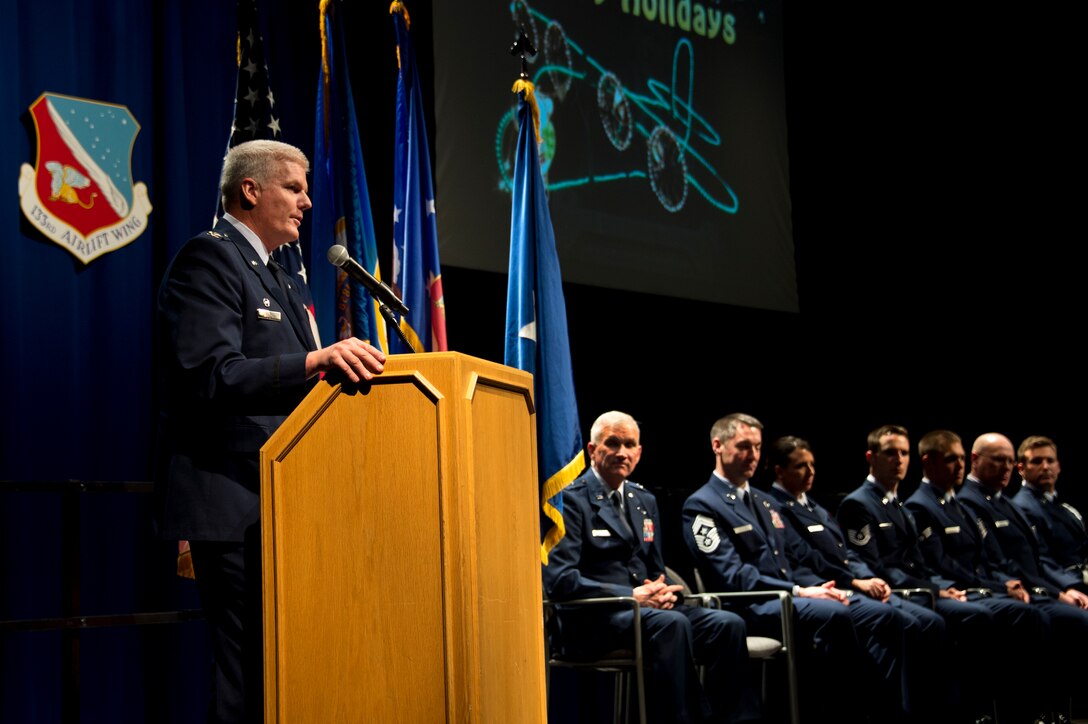 Col. Jim Johnson, left, 133rd Airlift Wing Commander gives his holiday address to Airmen of the 133rd Airlift Wing during the annual Wing Awards Ceremony in St. Paul, Minn., Dec 14, 2013. The award ceremony recognizes outstanding Airmen throughout the wing. (U.S. Air National Guard photo by Staff Sgt. Austen Adriaens/Released)