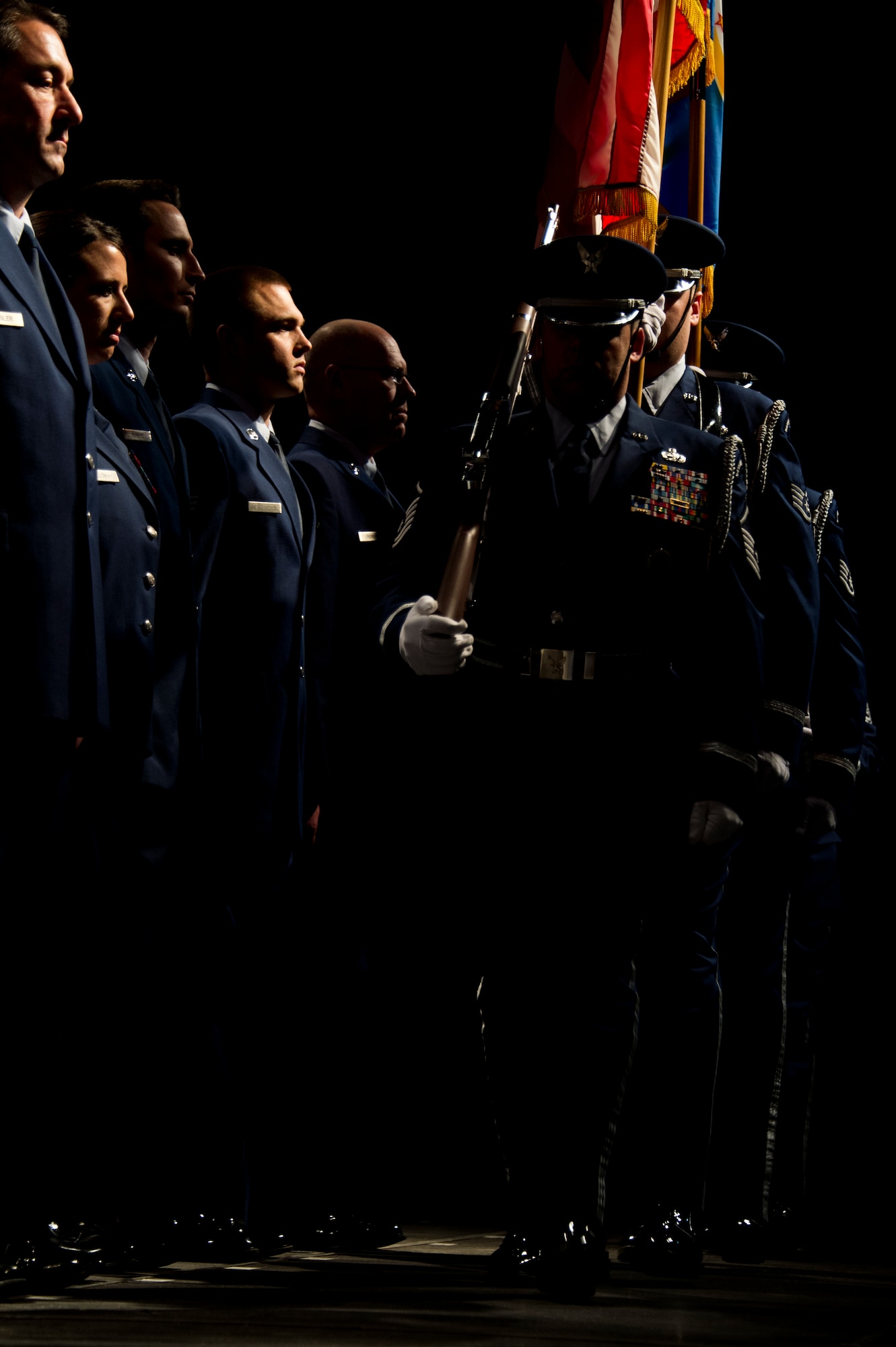 The 133rd Airlift Wing Honor Guard takes the stage during the annual Wing Awards Ceremony in St. Paul, Minn., Dec 14, 2013. These Airmen perform at ceremonies and events all over the state of Minnesota. (U.S. Air National Guard photo by Staff Sgt. Austen Adriaens/Released)