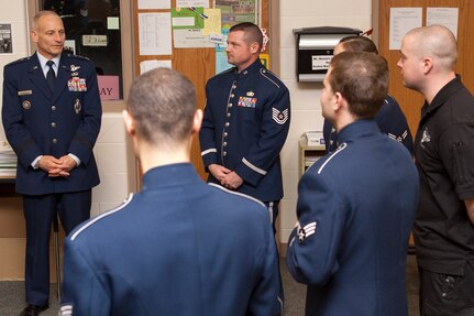 GRETNA, Neb. (Dec. 15, 2013) Lt. Gen. James Kowalski, U.S. Strategic Command (USSTRATCOM) deputy commander, praises Heartland of America Band members following a USSTRATCOM-hosted holiday concert at Gretna High School. The five concerts being held in the Omaha area feature senior leadership from USSTRATCOM, the 55th Wing, and the Air Force Weather Agency delivering holiday greetings to the community. (U.S. Navy photo by Mass Communication Specialist 1st Class Byron C. Linder/Released)
