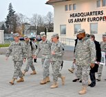 WIESBADEN, Germany – The Chairman of the Joint Chiefs of Staff, Gen. Martin E. Dempsey, is escorted by the U.S. Army Europe Deputy Commanding General, Maj. Gen. Richard C. Longo, and USAREUR Senior Enlisted Advisor, Command Sgt. Maj. David S. Davenport, during a visit to USAREUR Headquarters on Clay Kaserne, Dec. 12. Dempsey’s visit to USAREUR concludes the seven-day, four-country USO Chairman's Holiday Tour. This is his first visit to Clay Kaserne since USAREUR HQ relocated here from Heidelberg. (Photo by Karl Weisel, U.S. Army Garrison Wiesbaden Public Affairs Office)