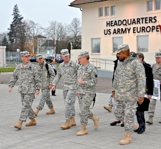 WIESBADEN, Germany – The Chairman of the Joint Chiefs of Staff, Gen. Martin E. Dempsey, is escorted by the U.S. Army Europe Deputy Commanding General, Maj. Gen. Richard C. Longo, and USAREUR Senior Enlisted Advisor, Command Sgt. Maj. David S. Davenport, during a visit to USAREUR Headquarters on Clay Kaserne, Dec. 12. Dempsey’s visit to USAREUR concludes the seven-day, four-country USO Chairman's Holiday Tour. This is his first visit to Clay Kaserne since USAREUR HQ relocated here from Heidelberg. (Photo by Karl Weisel, U.S. Army Garrison Wiesbaden Public Affairs Office)