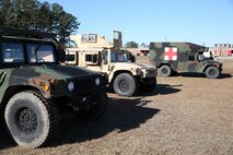 High Mobility Multipurpose Wheeled Vehicles, which belong to Ragnarok Company, 2nd Supply Battalion, 2nd Marine Logistics Group, rest near the command operating center following a supply convoy during a field exercise aboard Camp Lejeune, N.C., Dec. 11, 2013. Service members with the company conducted mobility and throughput operations, which consisted of checking out equipment, loading it into vehicles and keeping continuous radio communications with the convoys moving equipment between five sites used in the FEX. 