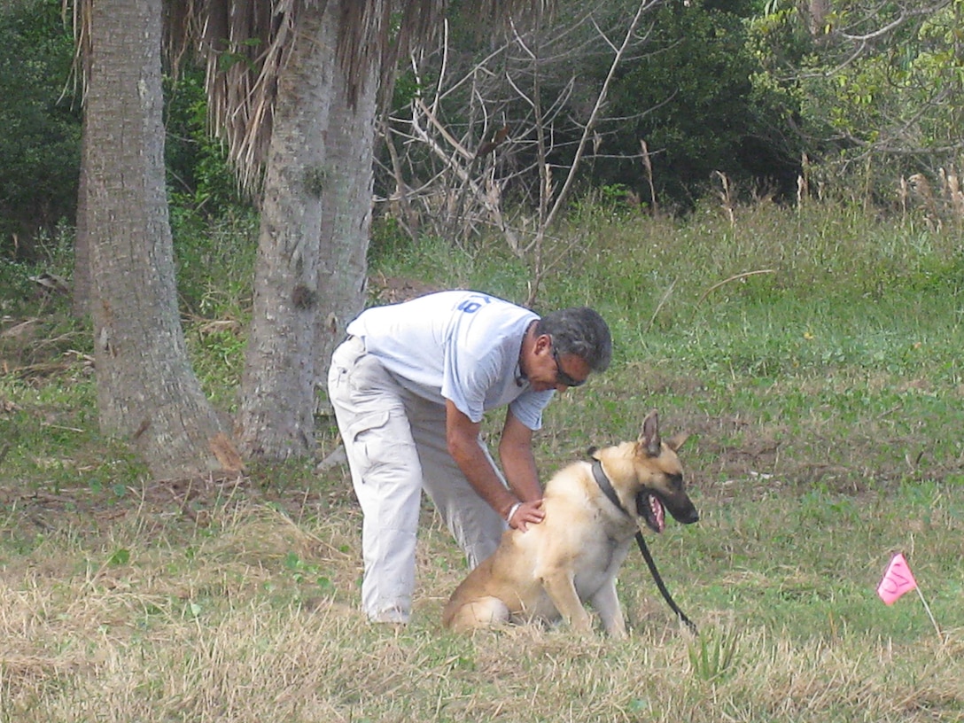 Matos signals to his handler, Stevie Valencia of AMK9, that he has found his target by sitting and waiting for confirmation. Once confirmed that he was successful, he’ll receive a special toy as a reward.