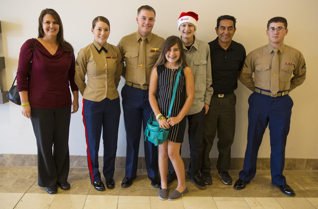 Jared and his family stand with the Marines from Camp Pendleton during his Make-A-Wish wish at the Westfield North County Mall. The Marines escorted Jared through the mall during his shopping-spree and answered many Marine Corps related questions the 15-year-old had. 