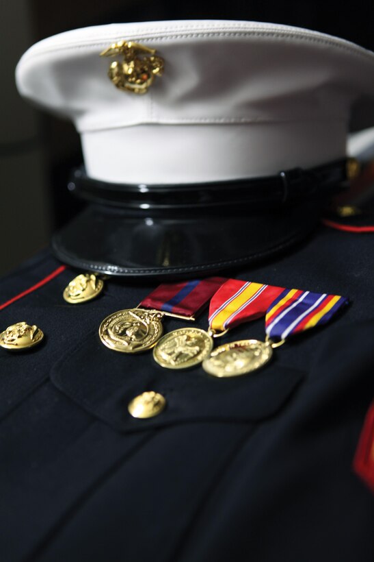 Female Marines are now authorized to wear the current male dress and service caps.