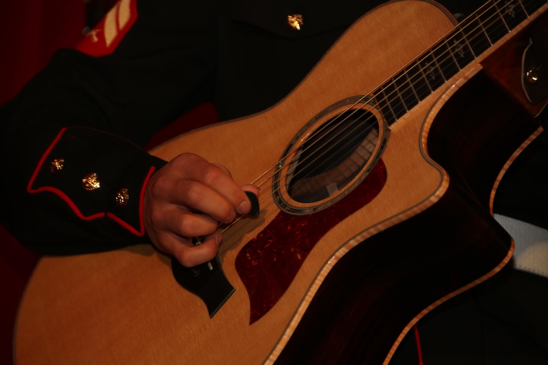 A band member of the 3rd Marine Aircraft Wing (MAW) Band plays the guitar during the 3rd MAW Band Holiday Concert aboard Marine Corps Air Station Miramar, Calif., Dec. 14. The band plays a holiday concert annually featuring different Christmas songs.