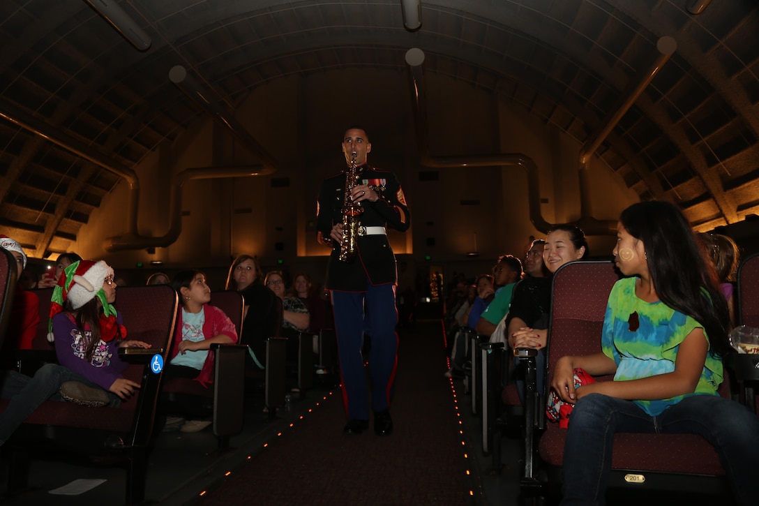 Staff Sgt. Mark Pellon, saxophone player with the 3rd Marine Aircraft Wing (MAW) Band, plays a solo during the 3rd MAW Band Holiday Concert aboard Marine Corps Air Station Miramar, Calif., Dec. 14. The band plays a holiday concert annually featuring different Christmas songs.