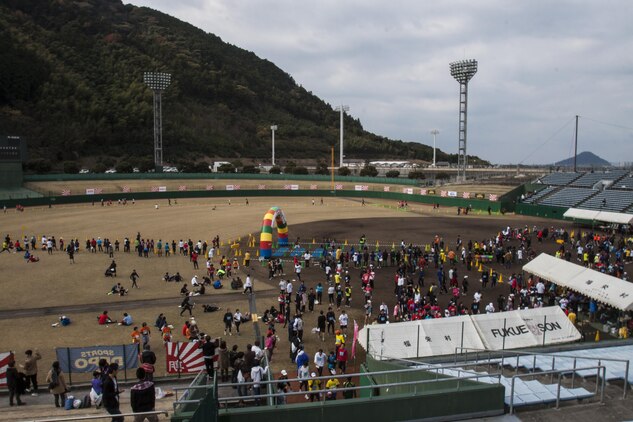 Participants of the Hagi Castle Race run the final stretch of the event inside a baseball stadium in Hagi, Dec. 8, 2013. Thousands of runners participated in the annual event.