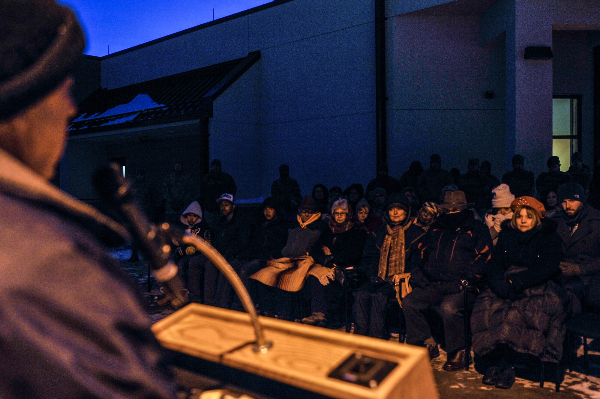 Craig Mansfield, father of the late Senior Airman Kristopher Mansfield, addresses a crowd during a tree-lighting ceremony Dec. 9, 2013, at Buckley Air Force Base, Colo. The tree was lit in memory of Kristopher, a former 460th Space Communications Squadron member who was killed by a drunk driver. Family and friends decorate the tree annually in celebration of Mansfield’s life and what he meant to the squadron. (U.S. Air Force photo by Airman 1st Class Samantha Saulsbury/Released)