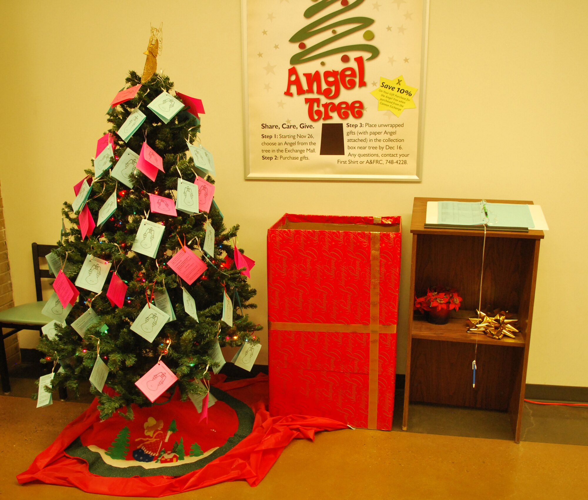 The Angel Tree, decorated with "angels" in need of sponsors during the holiday season, is on display Dec. 3, 2013, in the Exchange, at Cannon Air Force Base, N.M.  The Angel Tree program's goal is to make sure that every child in the Cannon community receives a present this year. Angel Tree gifts were accepted at the collection box near the tree until noon, Dec. 16. (U.S. Air Force photo/Desiree Ann Montenegro)