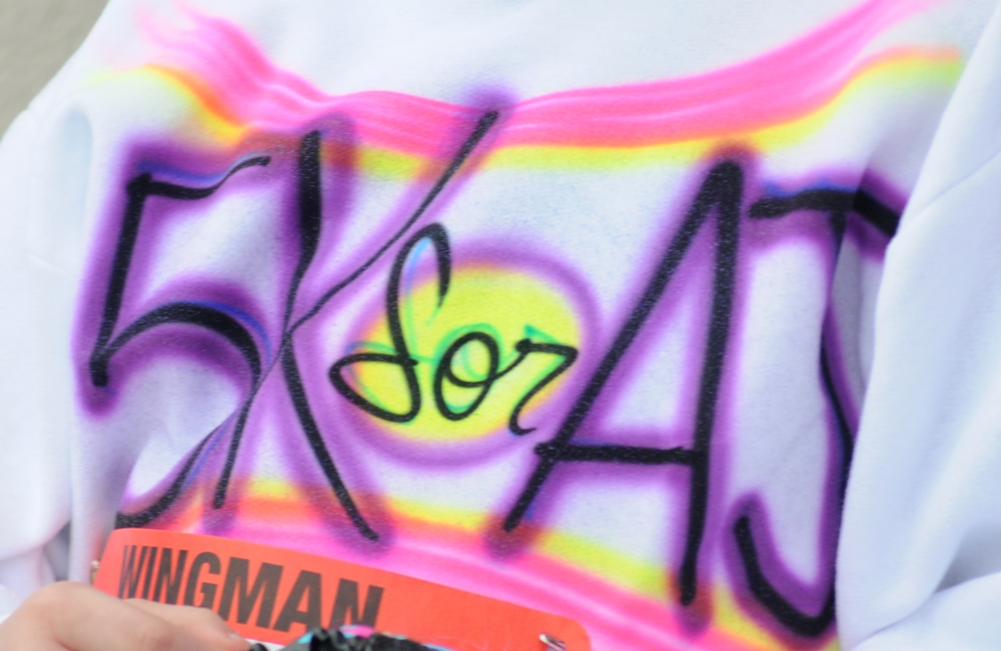 A child of Staff Sgt. Ashley Jackson and her husband, Master Sgt. Albert “AJ” Jackson, 335th Training Squadron, wears an airbrushed sweatshirt displaying “5K for AJ” during the “5K for AJ” benefit run Dec. 14, 2013, Keesler Air Force Base, Miss. The event, organized by the 335th TRS “Bulls,” was held to raise money for AJ, who was paralyzed from a medical procedure.  (U.S. Air Force photo by Kemberly Groue)