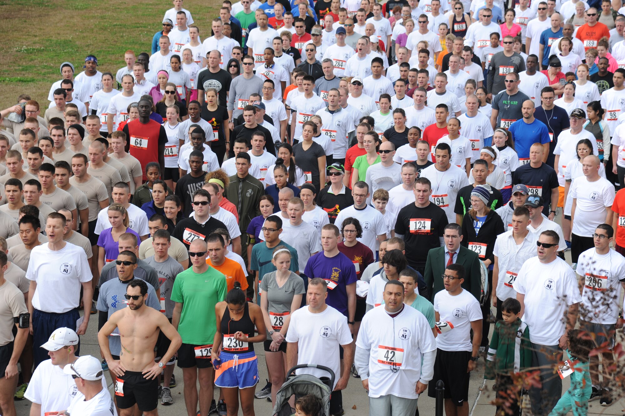 Participants recite the Airman’s Creed during the “5K for AJ” benefit run Dec. 14, 2013, Keesler Air Force Base, Miss. The 5K run was held to raise money for Master Sgt. Albert “AJ” Jackson, 335th TRS, who was paralyzed from a medical procedure. The event, organized by the 335th TRS “Bulls,” raised more than $15,700 to assist the family.  (U.S. Air Force photo by Kemberly Groue)