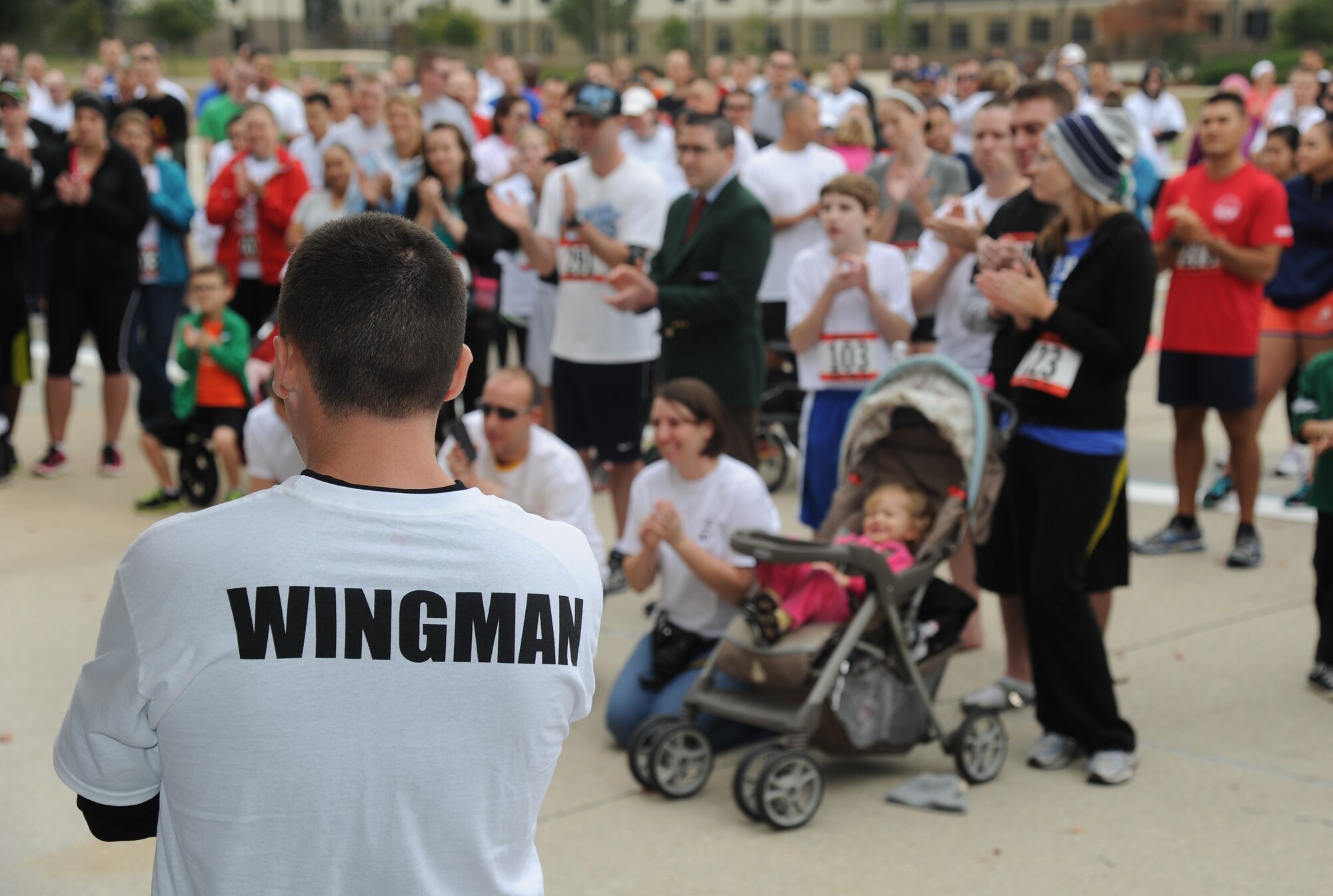 Senior Master Sgt. Jerrod Webb, 335th Training Squadron, delivers welcoming remarks during the “5K for AJ” benefit run Dec. 14, 2013, Keesler Air Force Base, Miss. The 5K run was held to raise money for Master Sgt. Albert “AJ” Jackson, 335th TRS, who was paralyzed from a medical procedure. The event, organized by the 335th TRS “Bulls,” raised more than $15,700 to assist the family.  (U.S. Air Force photo by Kemberly Groue)