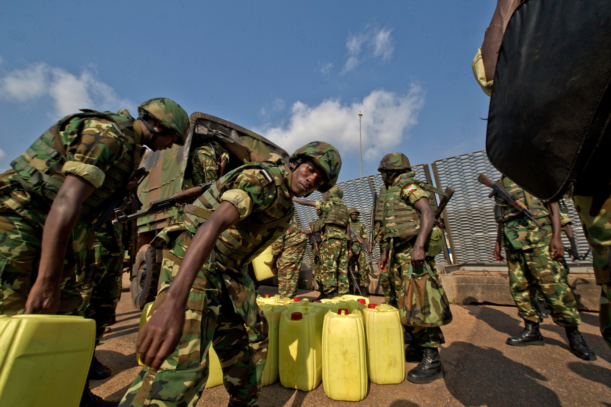 Burundi soldiers load their gear at the Bangui Airport, Central Africa Republic, Dec. 13, 2013. In coordination with the French military and African Union, the U.S. military provided airlift support to transport Burundi soldiers, food and supplies in the CAR. This support is aimed at enabling African forces to deploy promptly to prevent further spread of sectarian violence and restore security in CAR. (U.S. Air Force photo/Staff Sgt. Erik Cardenas)