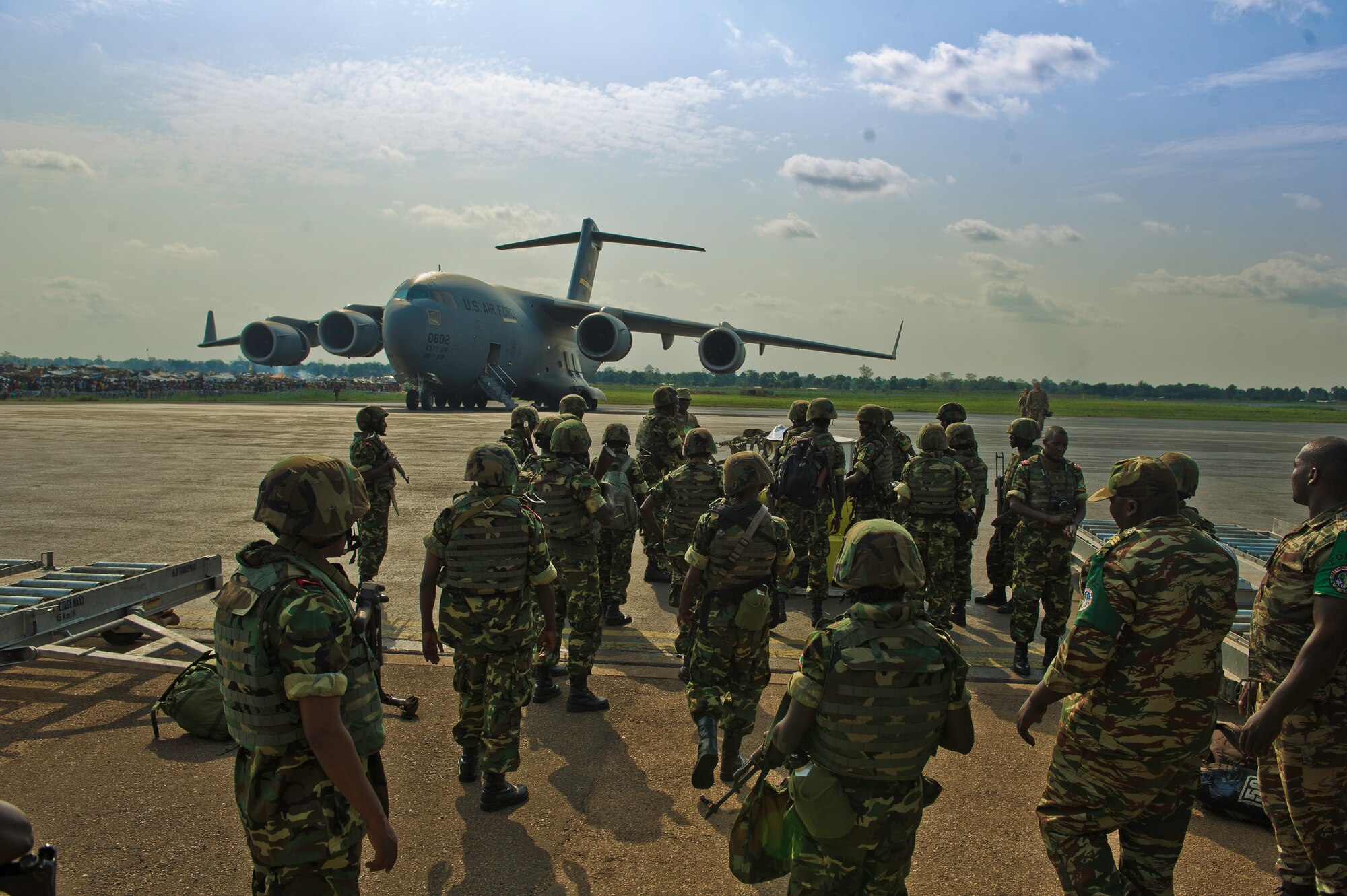 Burundi soldiers gather their gear at the Bangui Airport, Central Africa Republic, Dec. 13, 2013. In coordination with the French military and African Union, the U.S. military provided airlift support to transport Burundi soldiers, food and supplies in the CAR. This support is aimed at enabling African forces to deploy promptly to prevent further spread of sectarian violence and restore security in CAR. (U.S. Air Force photo/Staff Sgt. Erik Cardenas)