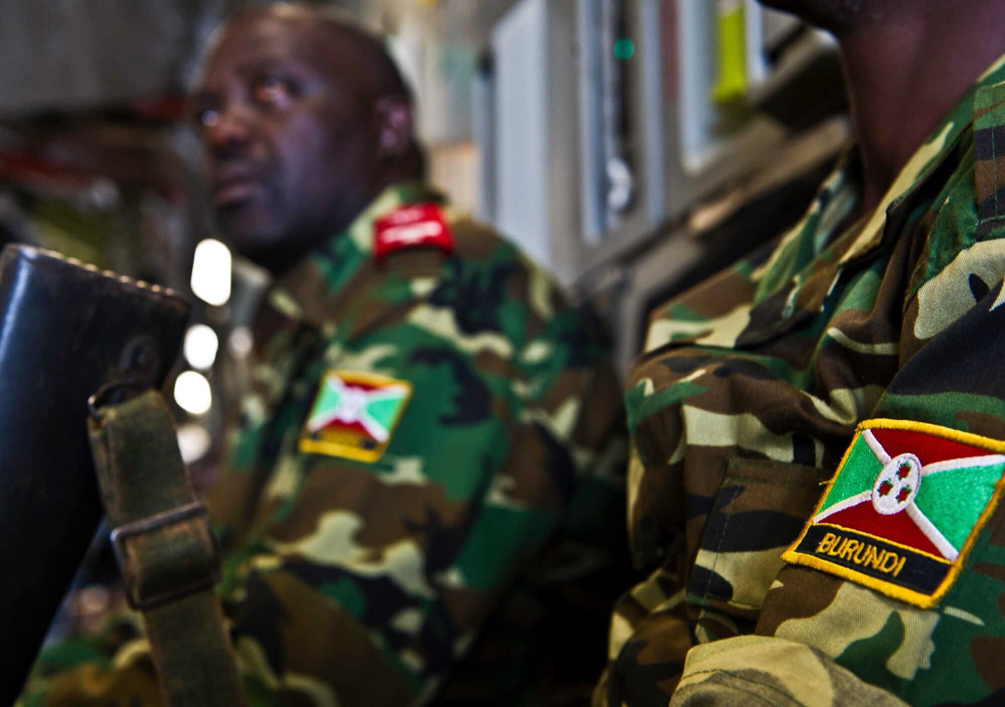 Burundi soldiers await take off in a C-17 Globemaster Dec. 13, 2013 at Bujmumbura Airport, Burundi. In coordination with the French military and African Union, the U.S. military provided airlift support to transport Burundi soldiers, food and supplies in the Central African Republic. This support is aimed at enabling African forces to deploy promptly to prevent further spread of sectarian violence and restore security in CAR. (U.S. Air Force photo/Staff Sgt. Erik Cardenas)