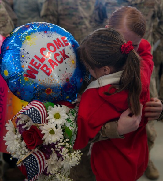 U.S. Air Force Airman 1st Class Jenny Walker, 823d Base Defense Squadron fireteam member, hugs Alison Thompson at Moody Air Force Base, Ga., Dec. 16 2013. Alison was one of many friends and family members who welcomed home Walker and many other Airmen. (U.S. Air Force Airman 1st Class Alexis Grotz/ Released)