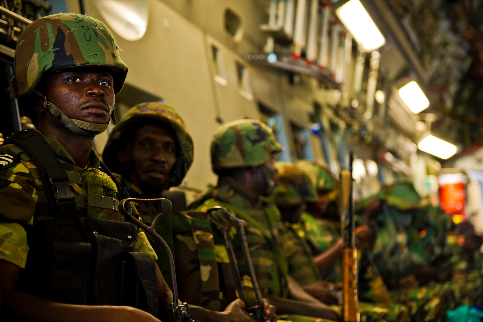 A Burundi soldier waits to take off in a C-17 Globemaster Dec. 13, 2013 at Bujmumbura Airport, Burundi. In coordination with the French military and African Union, the U.S. military provided airlift support to transport Burundi soldiers, food and supplies in the Central African Republic. This support is aimed at enabling African forces to deploy promptly to prevent further spread of sectarian violence and restore security in CAR. (U.S. Air Force photo/Staff Sgt. Erik Cardenas)